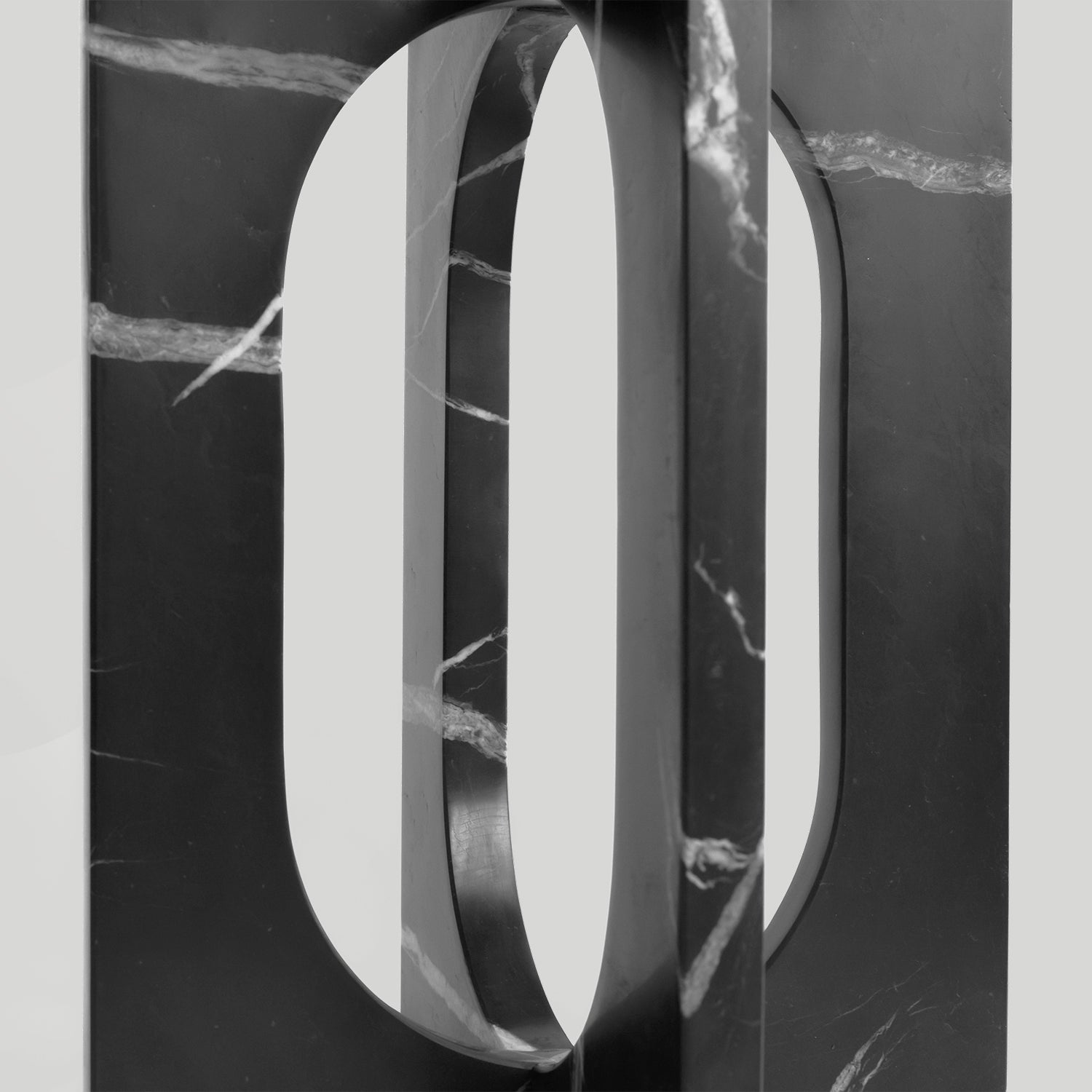 Black marble side table with square top and matte finish