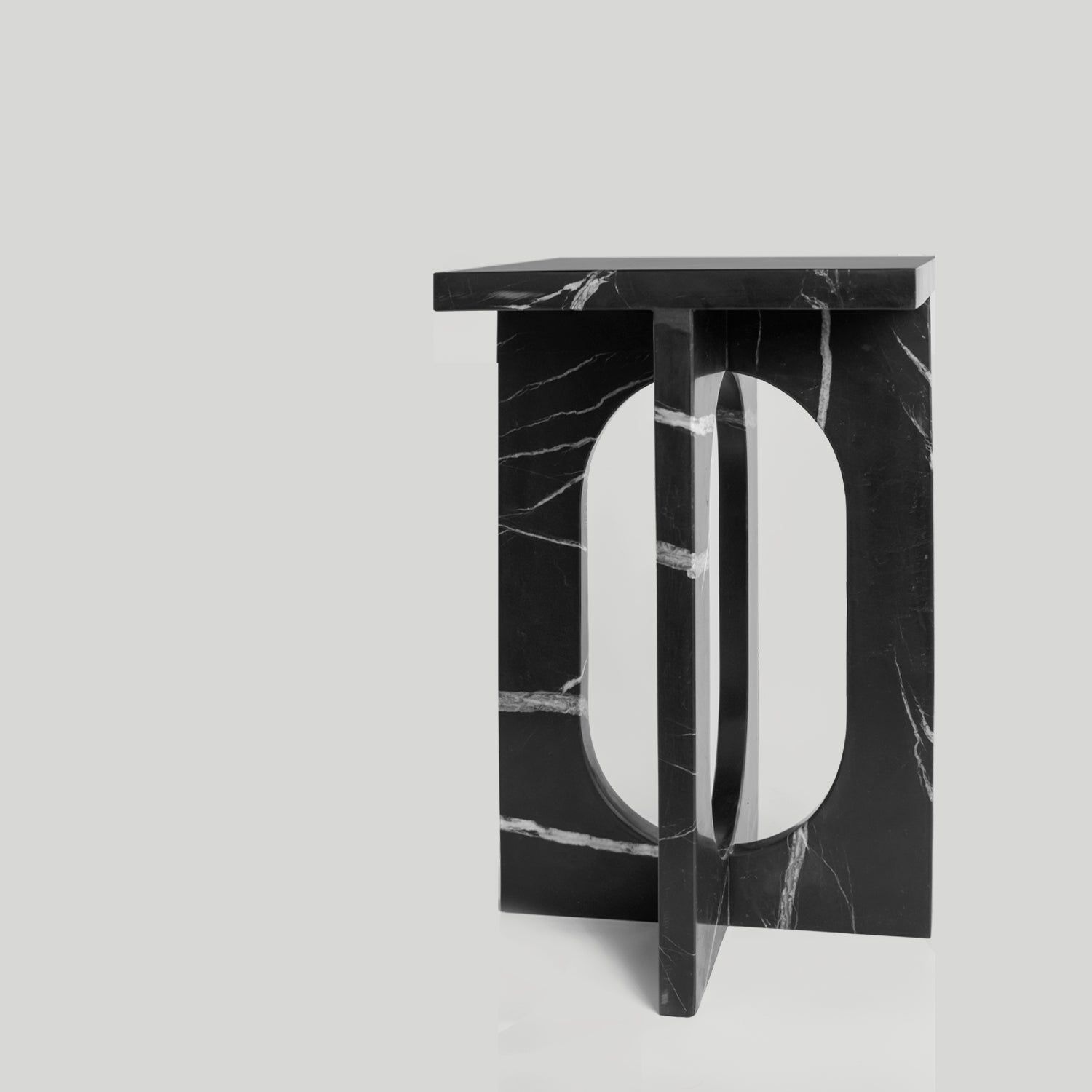 Black marble side table with square top and matte finish