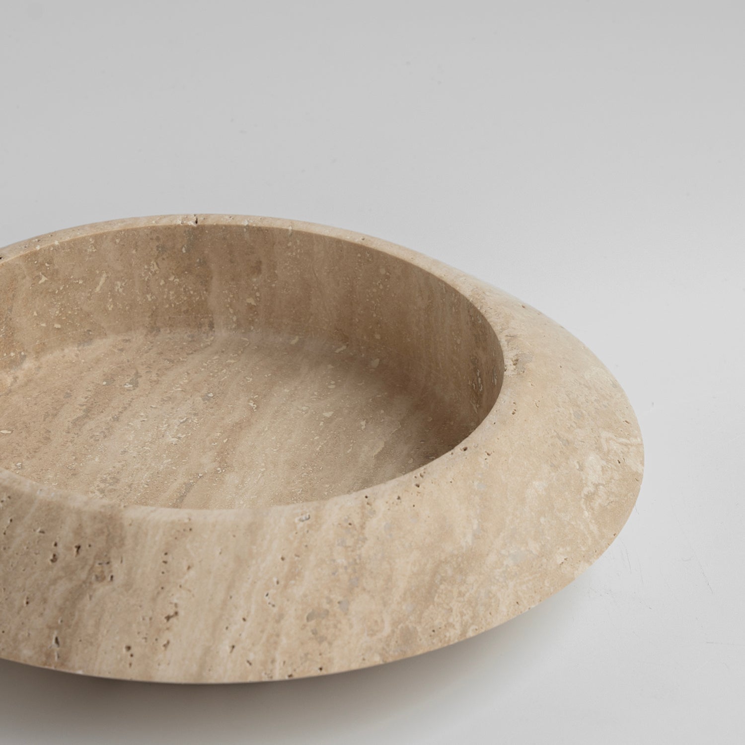 Large travertine bowl with natural stone veining