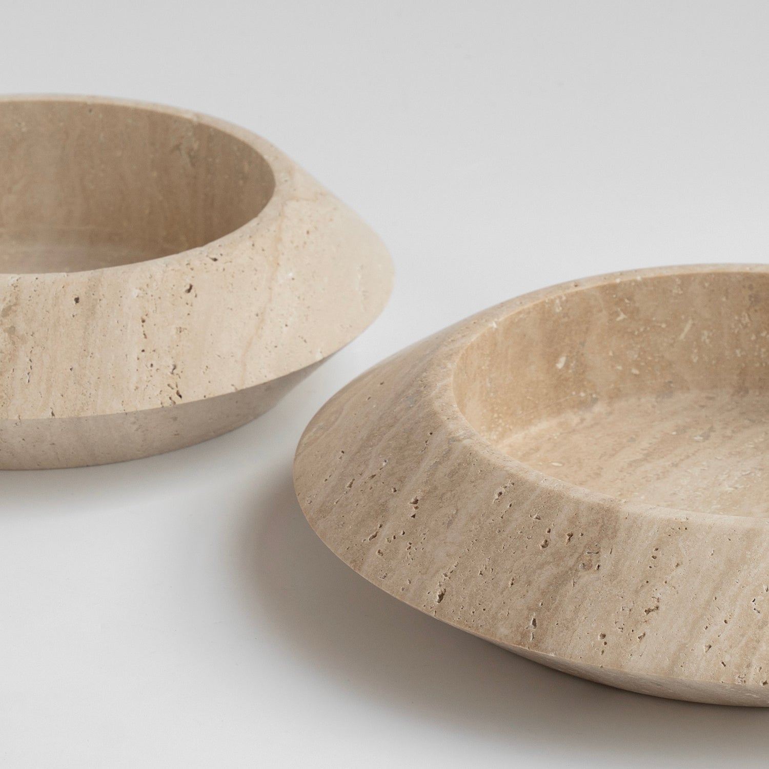 Decorative travertine bowl with natural stone texture
