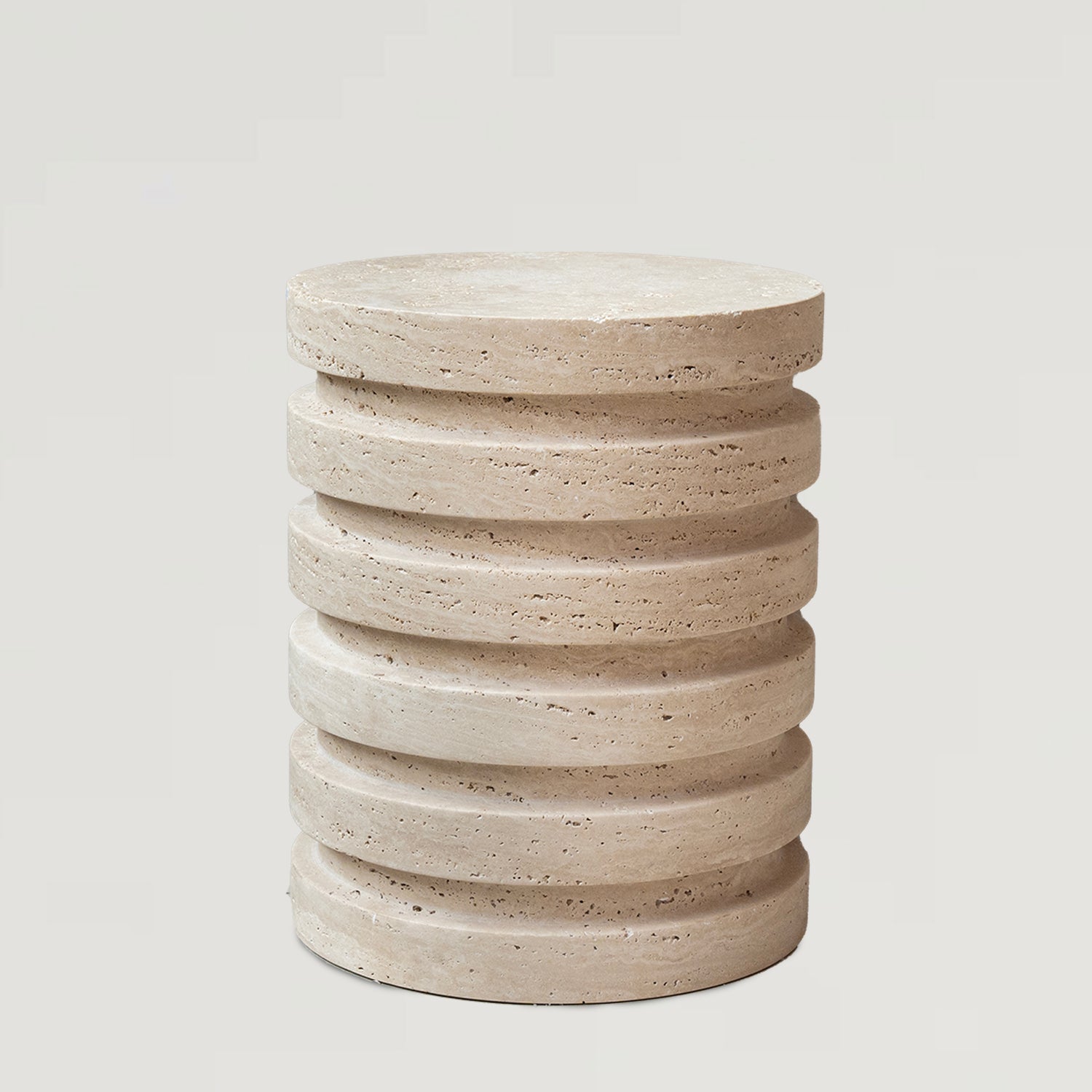 Layered travertine side table with sculptural stone base