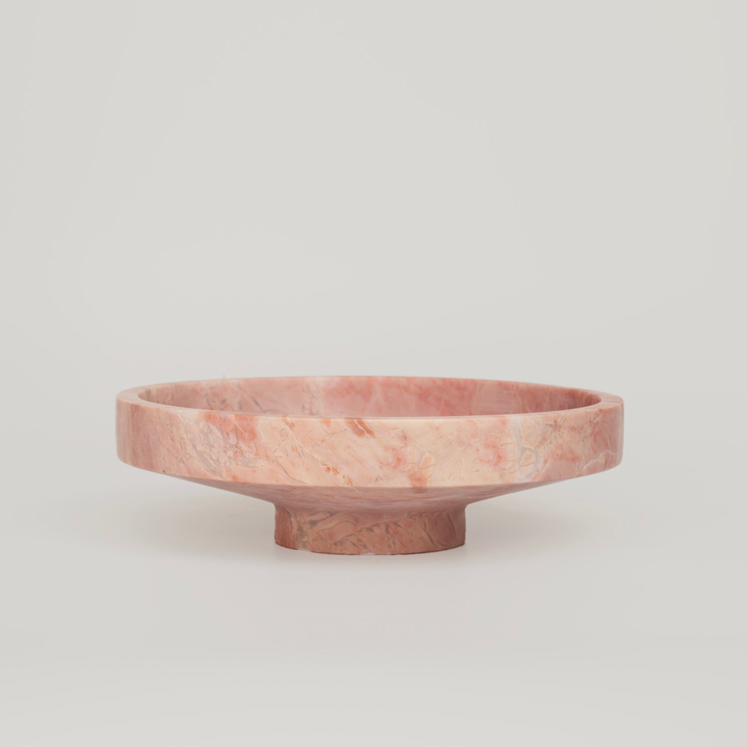 Pink marble bowl with smooth sculptural stone finish