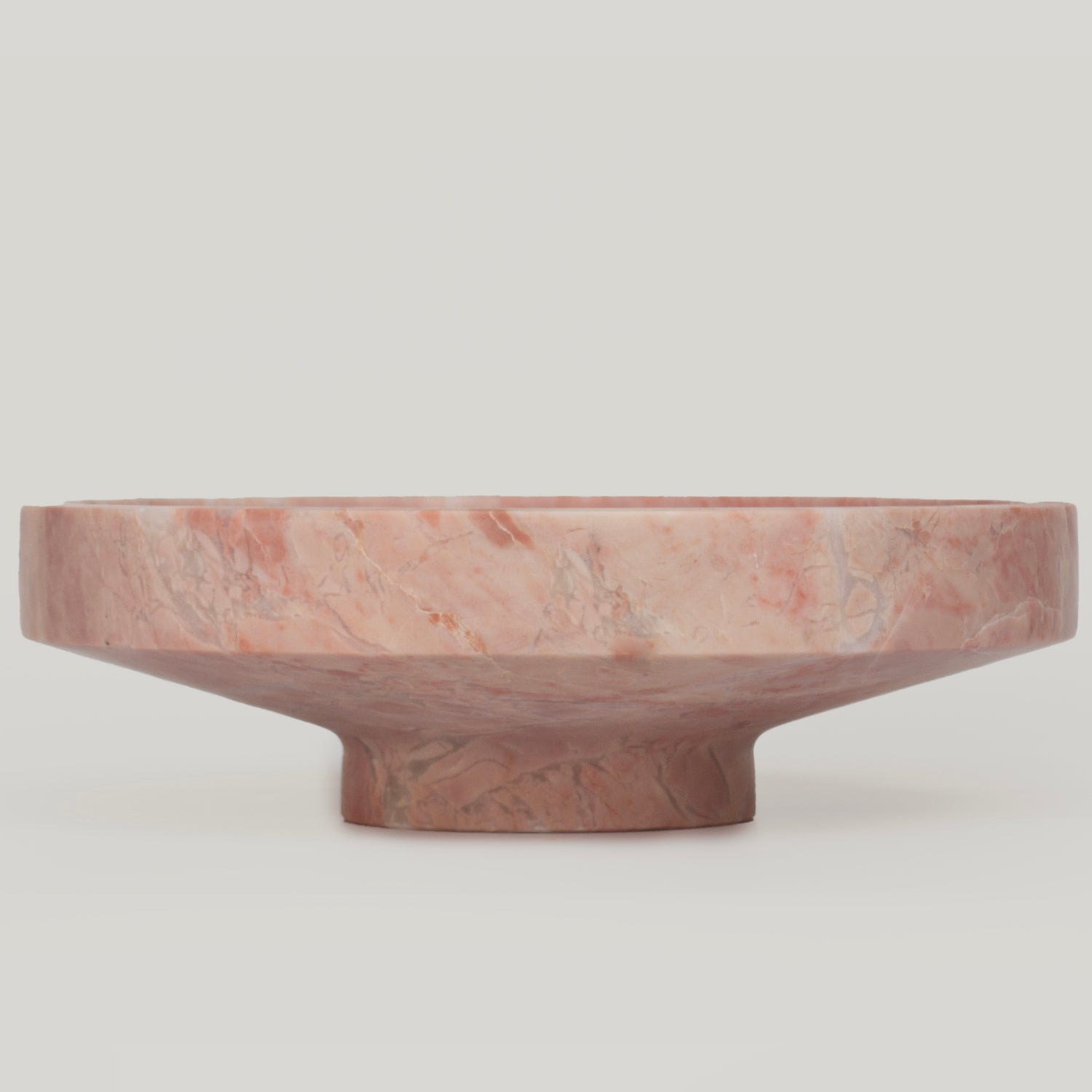 Pink marble bowl with smooth sculptural stone finish
