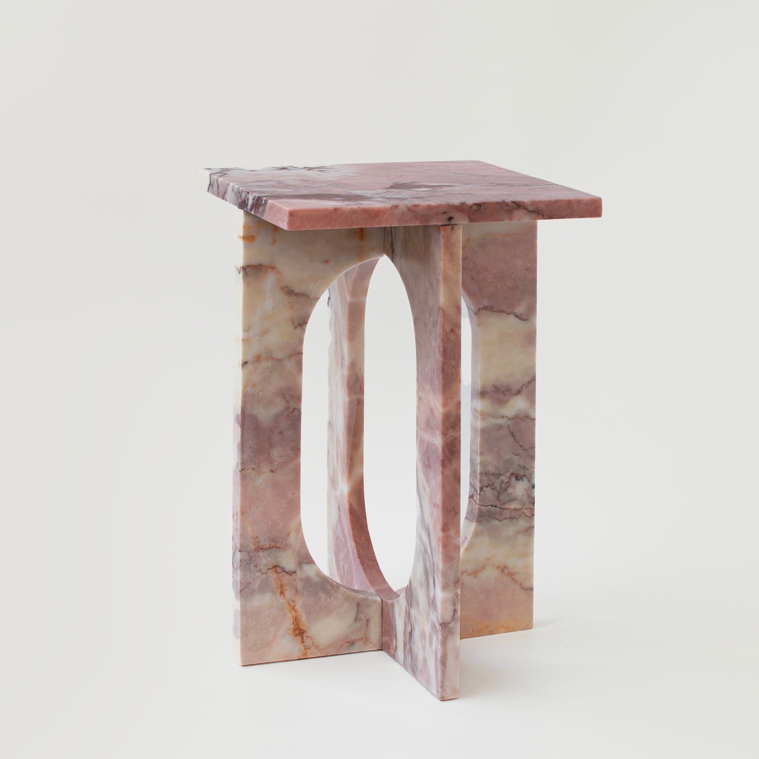 Pink marble side table with square top and stone base