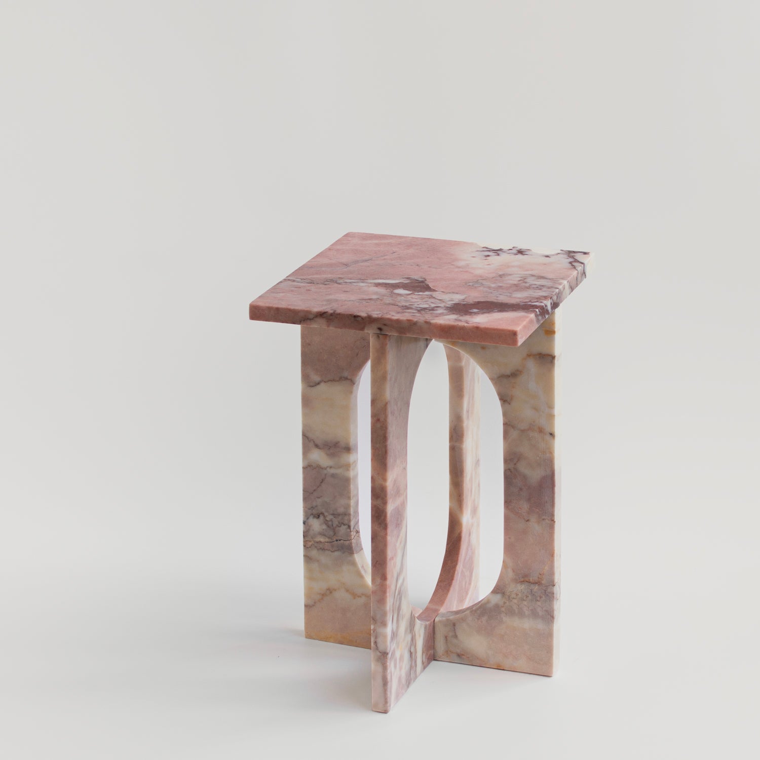Pink marble side table with square top and stone base