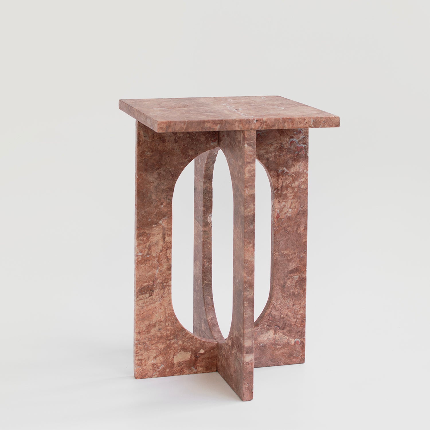 Red travertine marble side table with clean stone lines