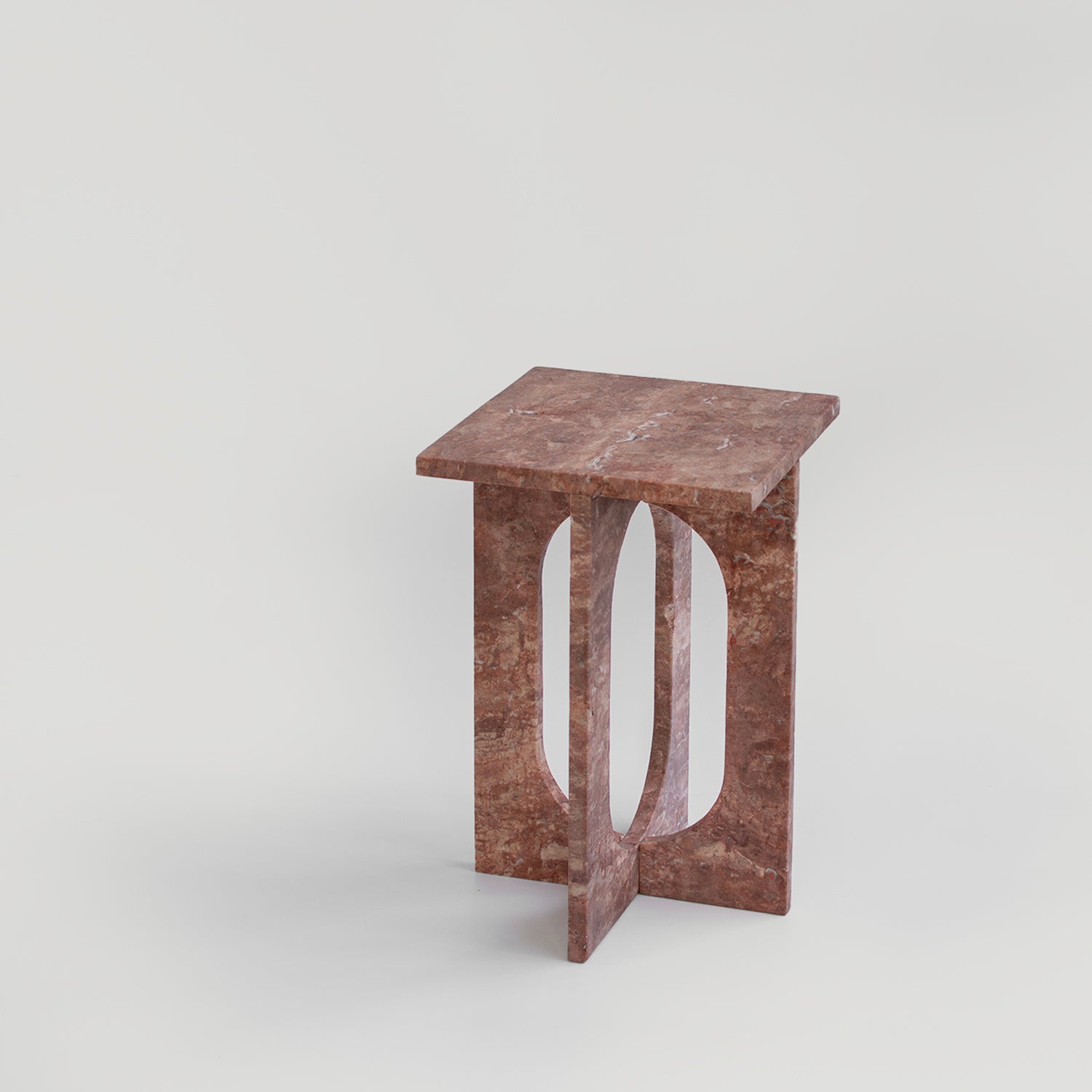 Red travertine marble side table with clean stone lines