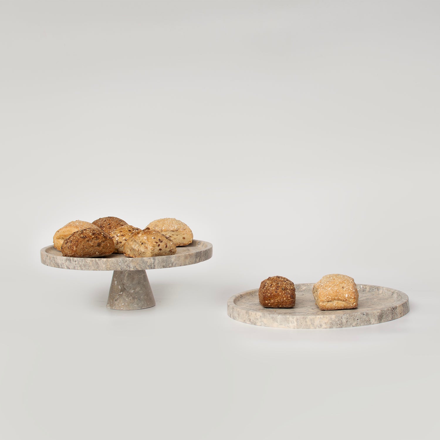 Silver travertine cake stand with round stone base