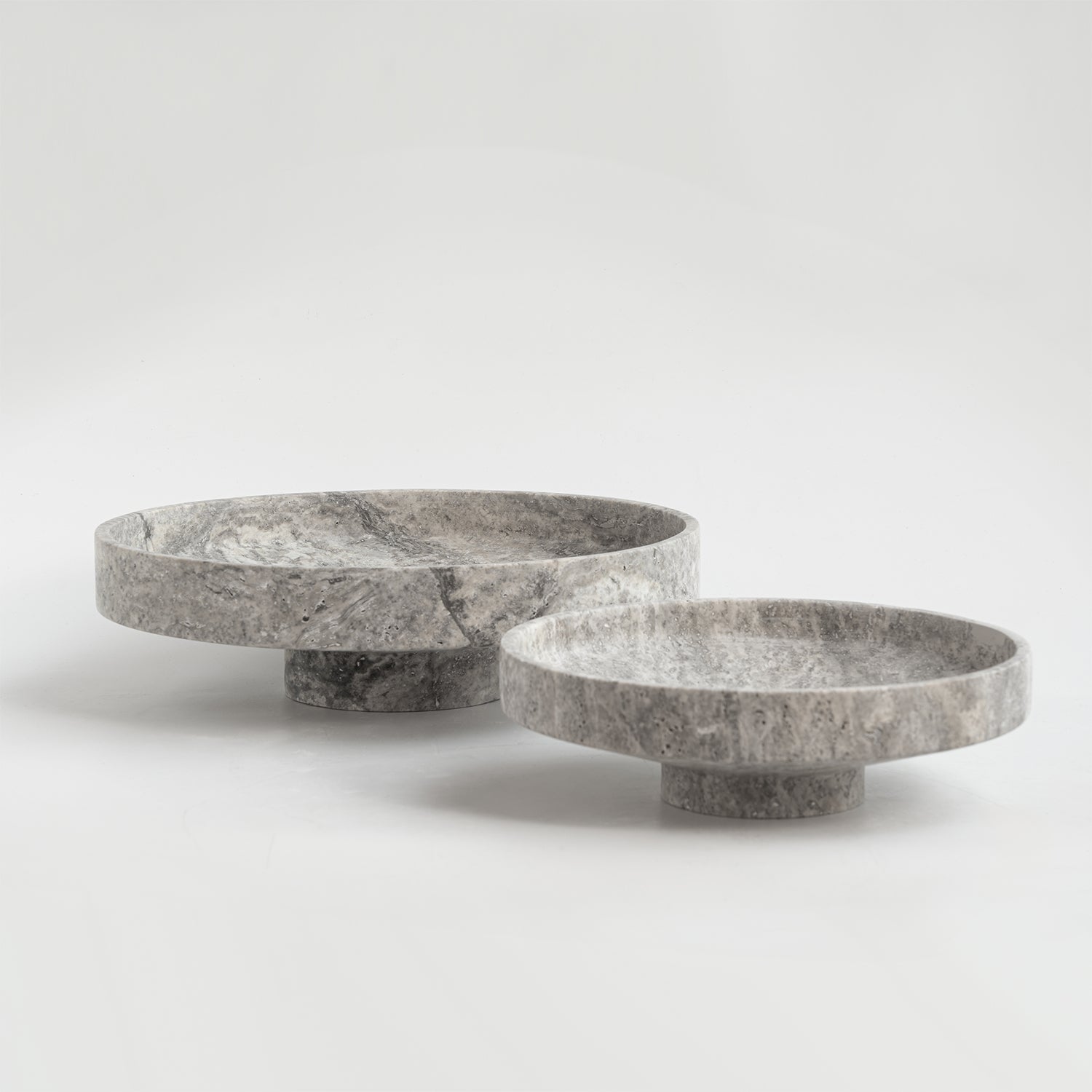 Silver travertine bowl with wide opening on display
