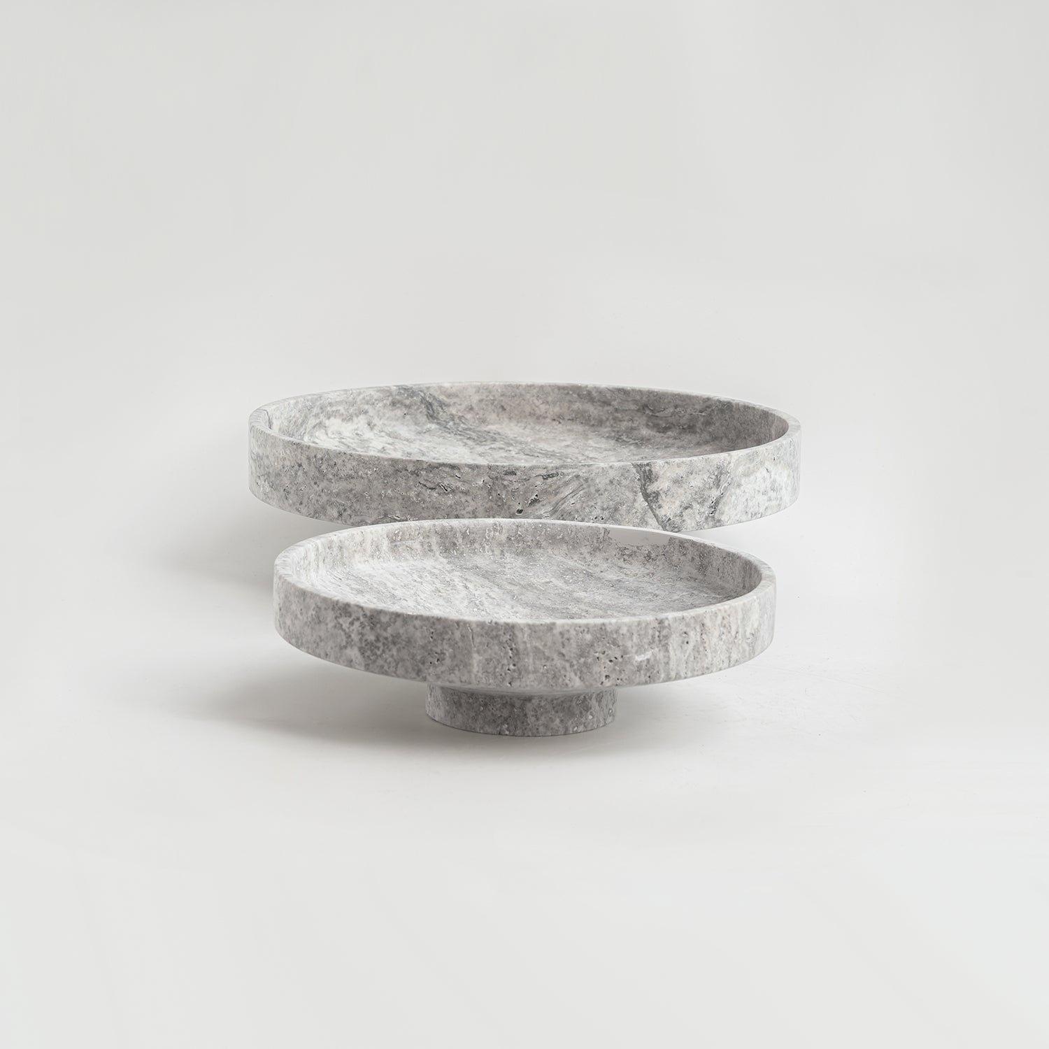 Silver travertine bowl with wide opening on display