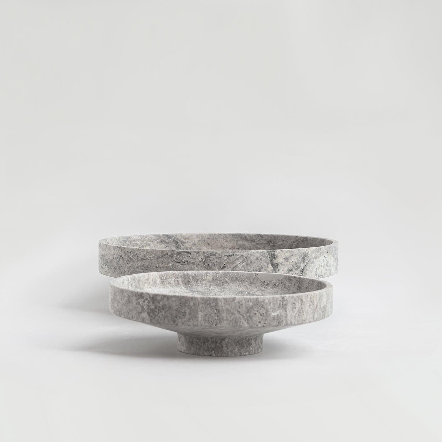 Silver travertine bowl with wide opening on display
