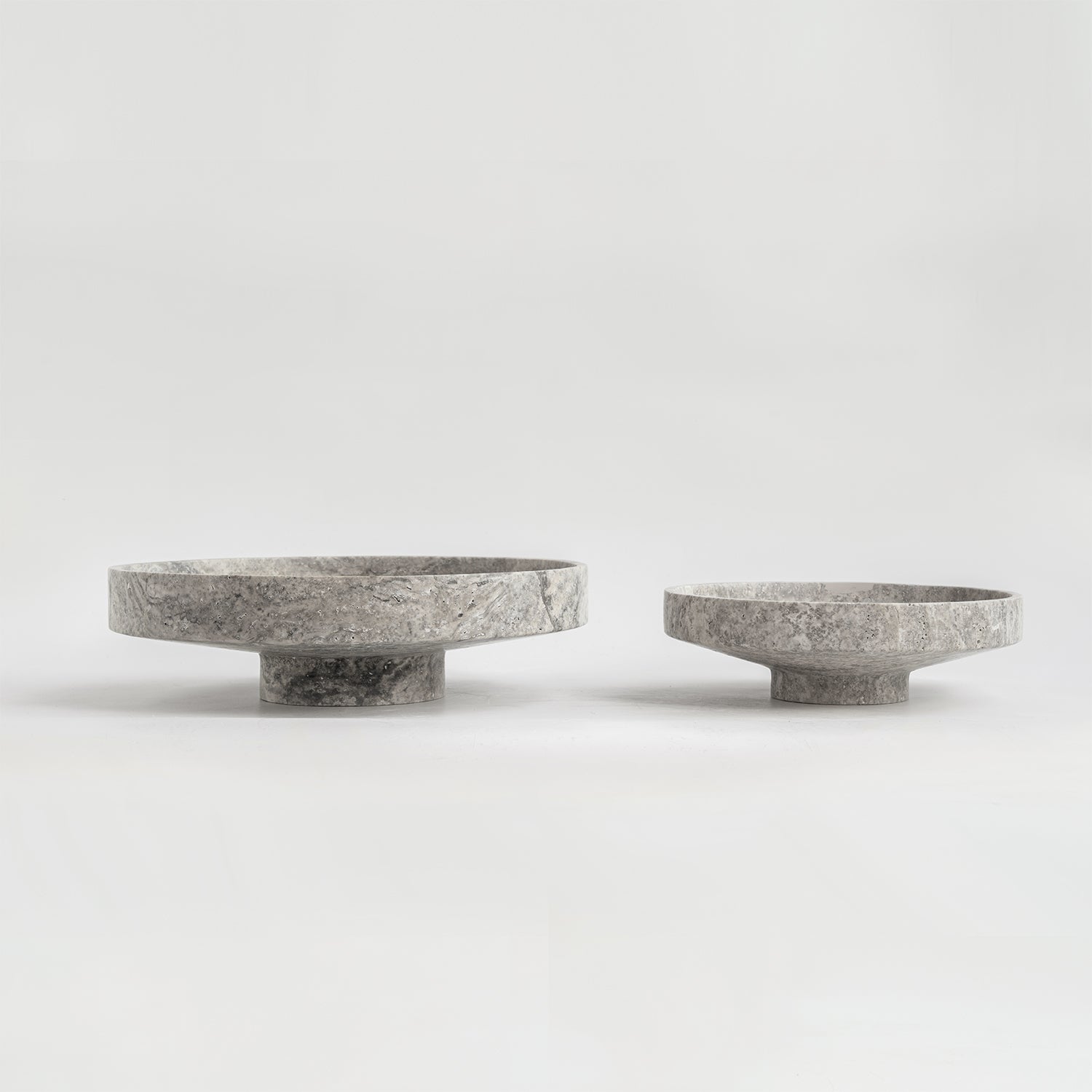 Silver travertine bowl with wide opening on display