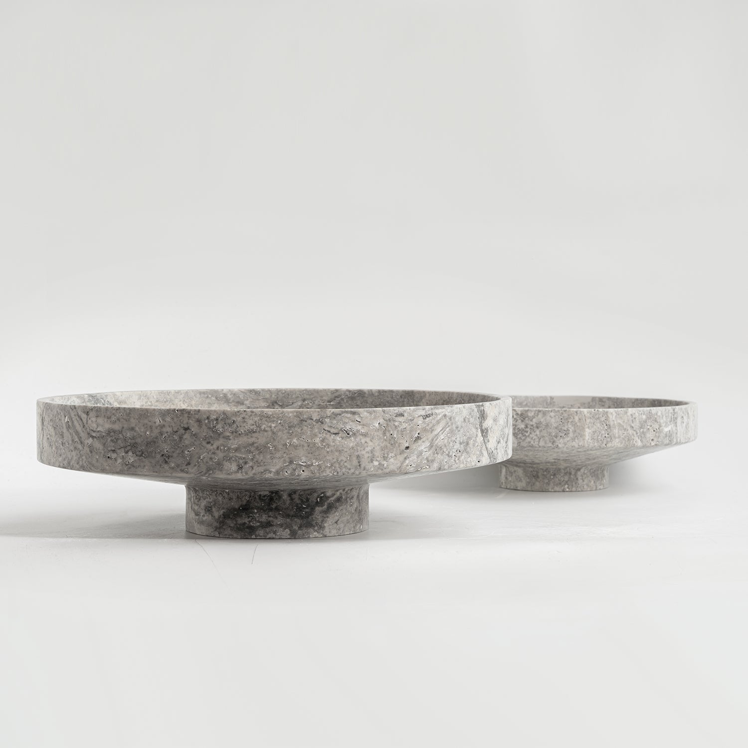 Silver travertine bowl with wide opening on display