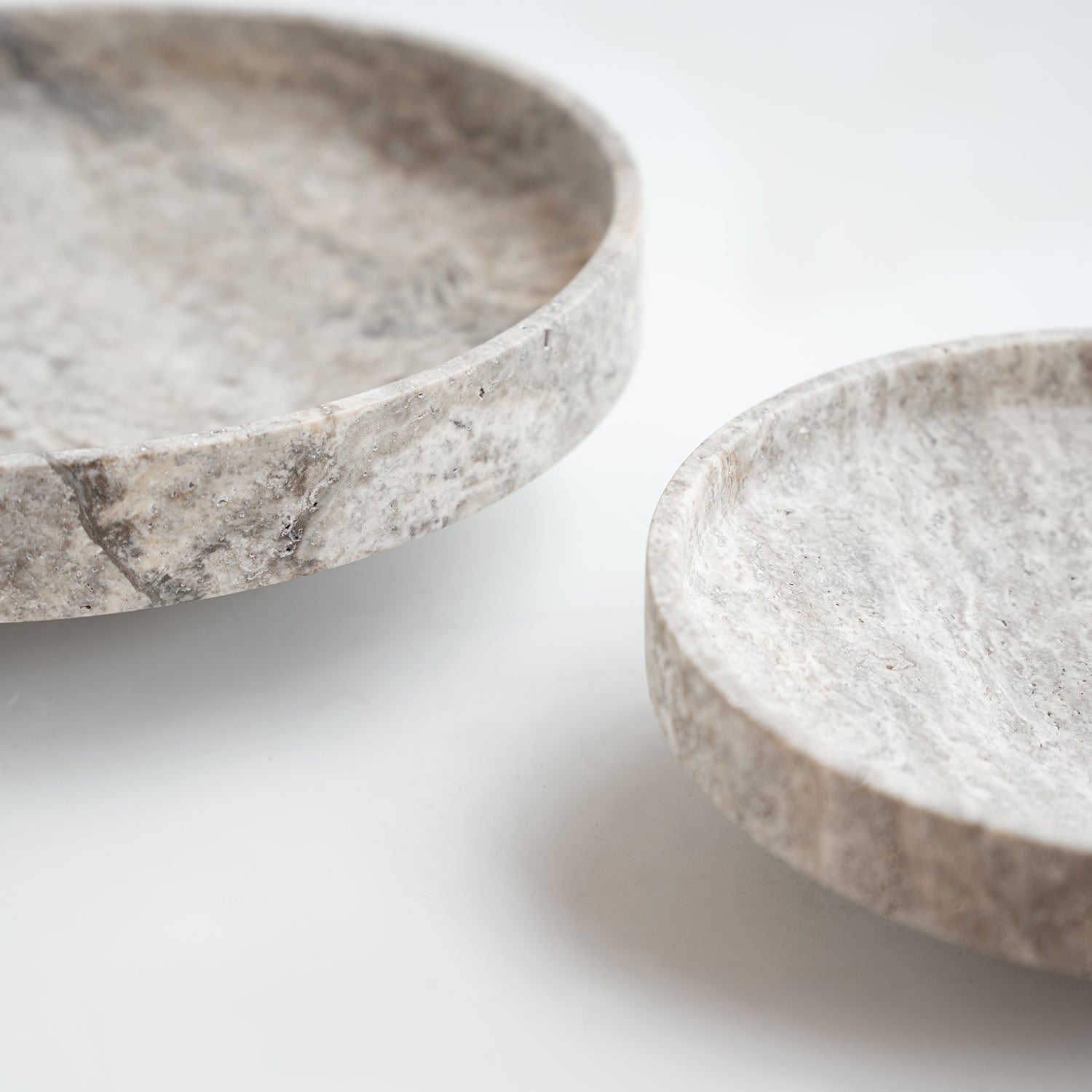 Silver travertine bowl with wide opening on display
