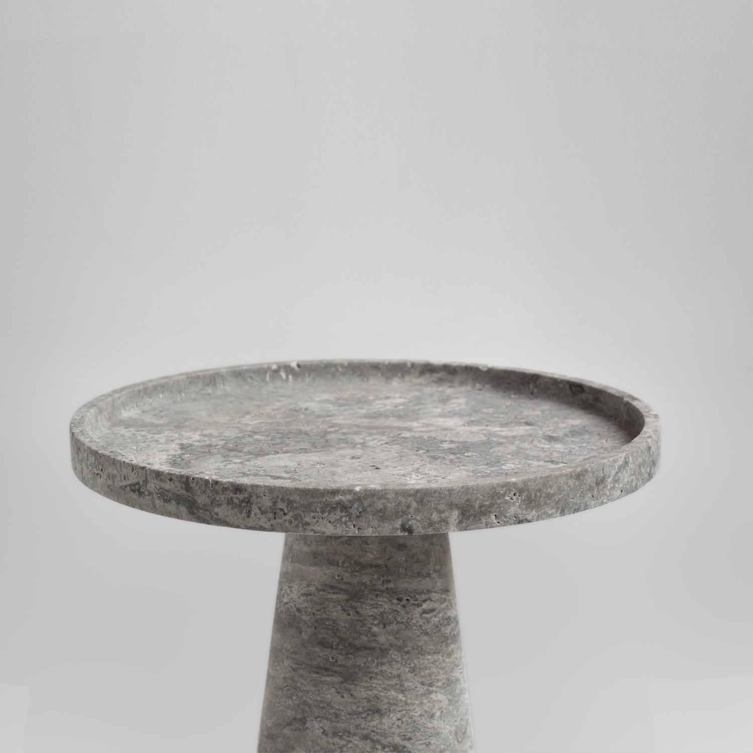 Silver travertine cone side table with polished stone base