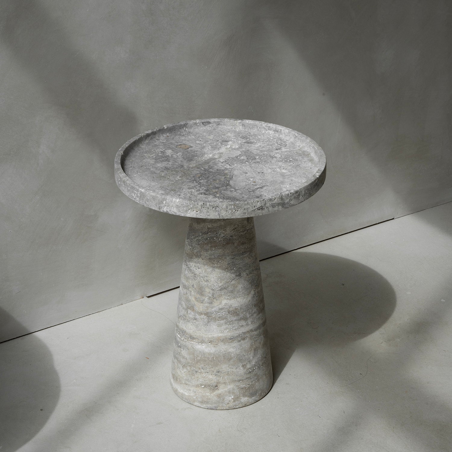 Silver travertine cone side table with polished stone base