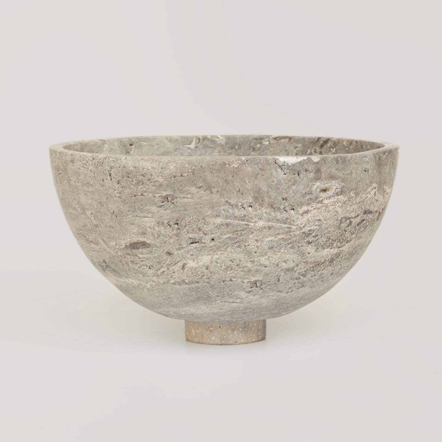 Silver travertine bowl with natural stone fruit display