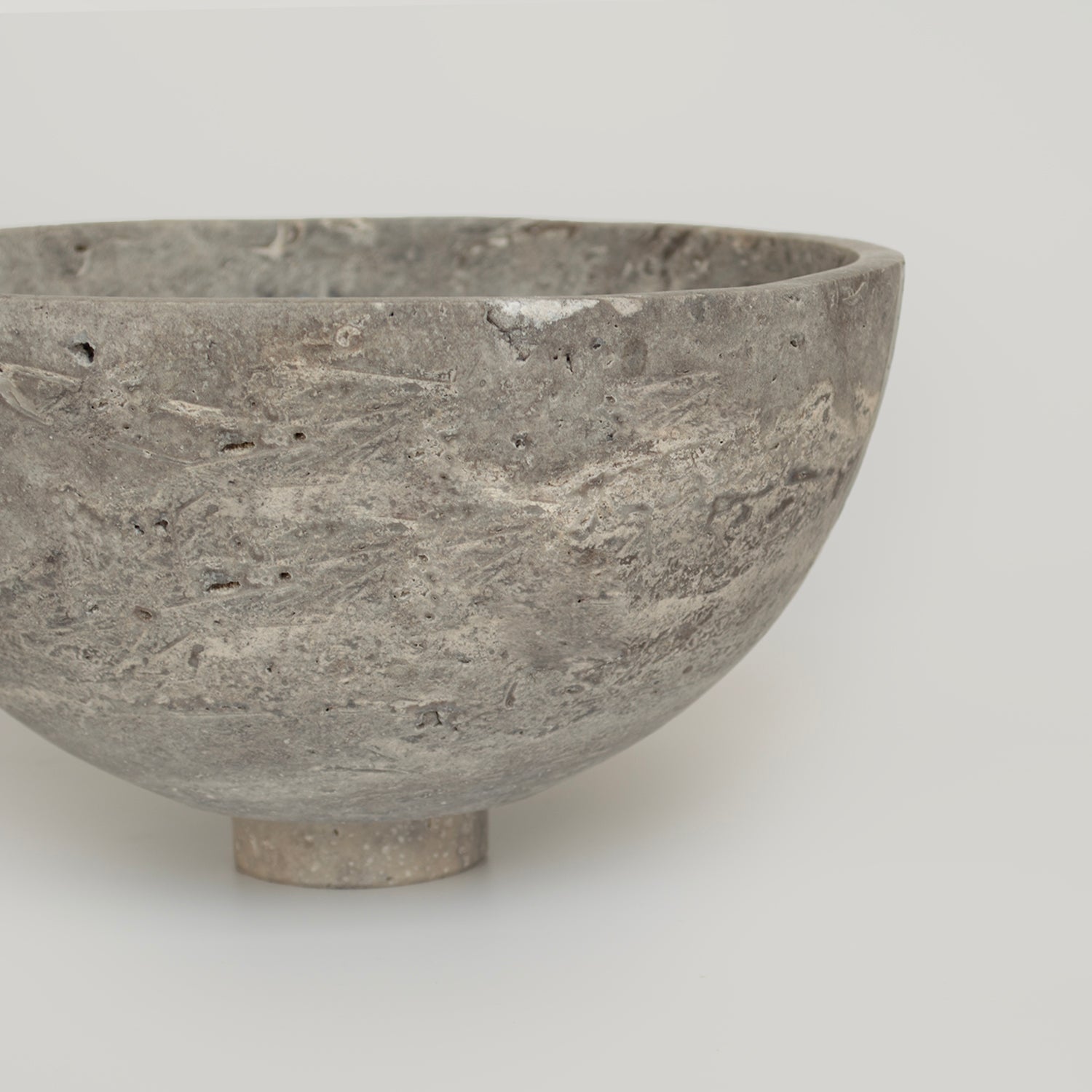 Silver travertine bowl with natural stone fruit display