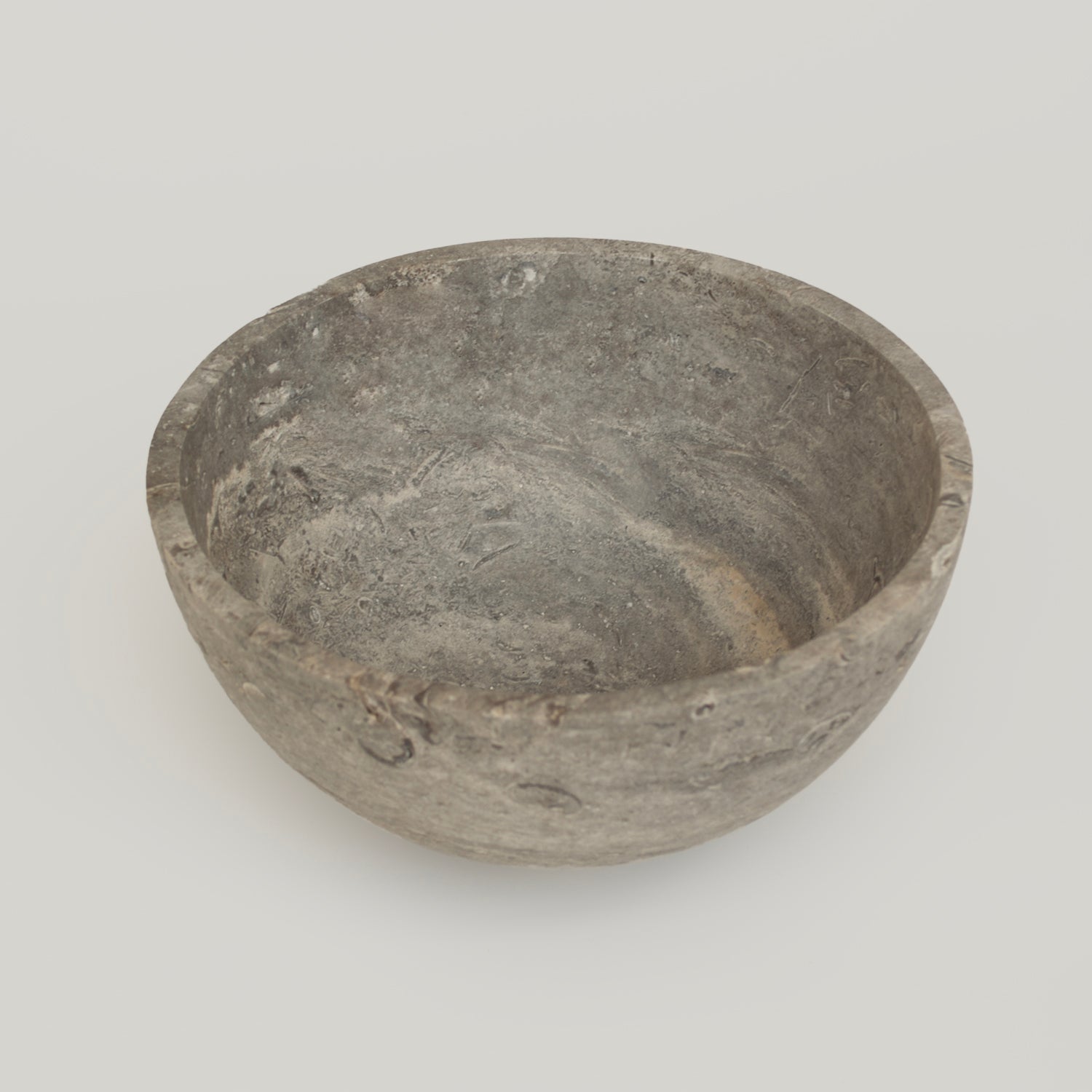 Silver travertine bowl with natural stone fruit display