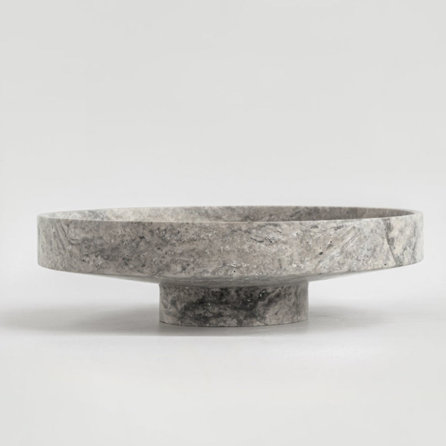 Silver travertine bowl with wide opening on display