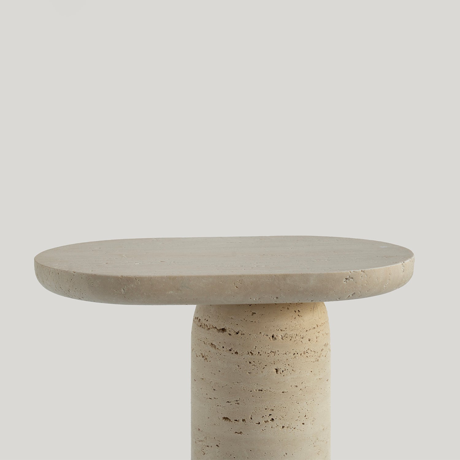 Travertine side table with clean stone finish
