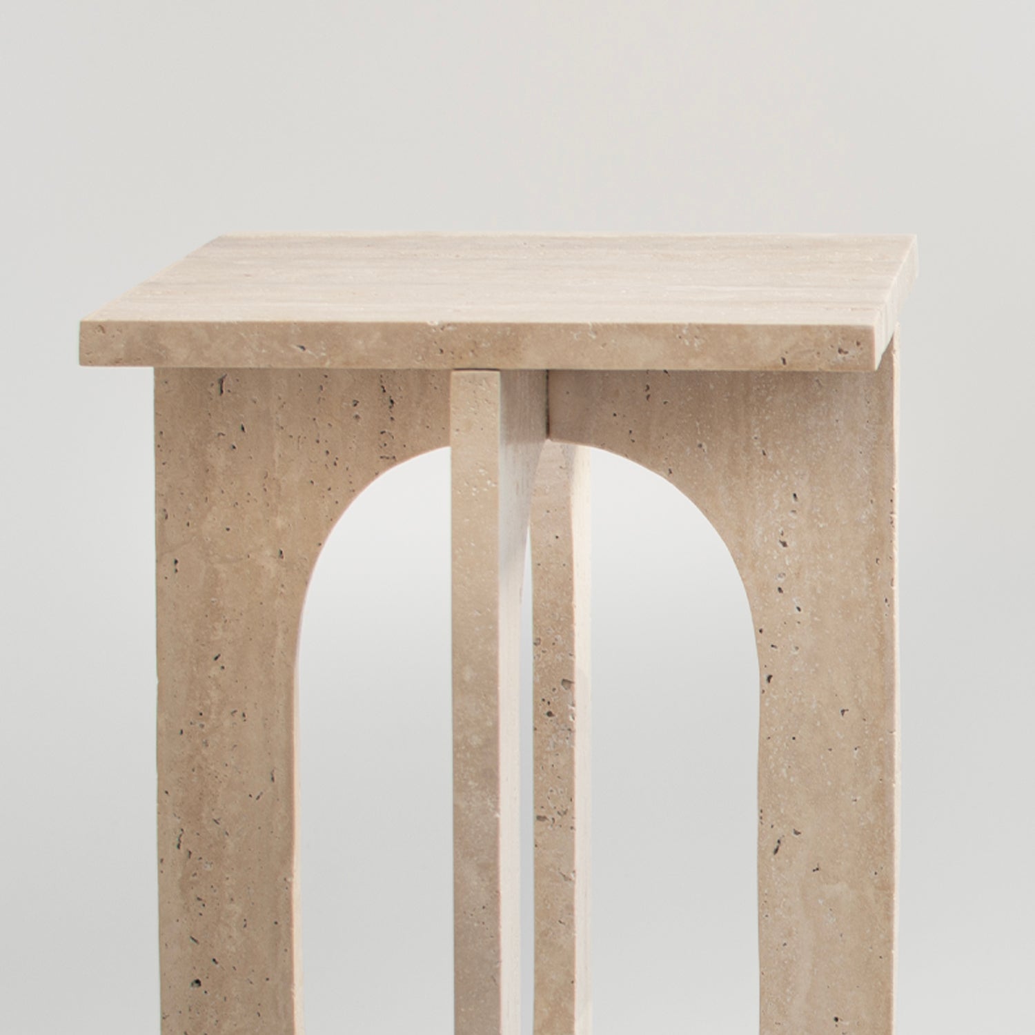 Travertine side table with square top and stone base