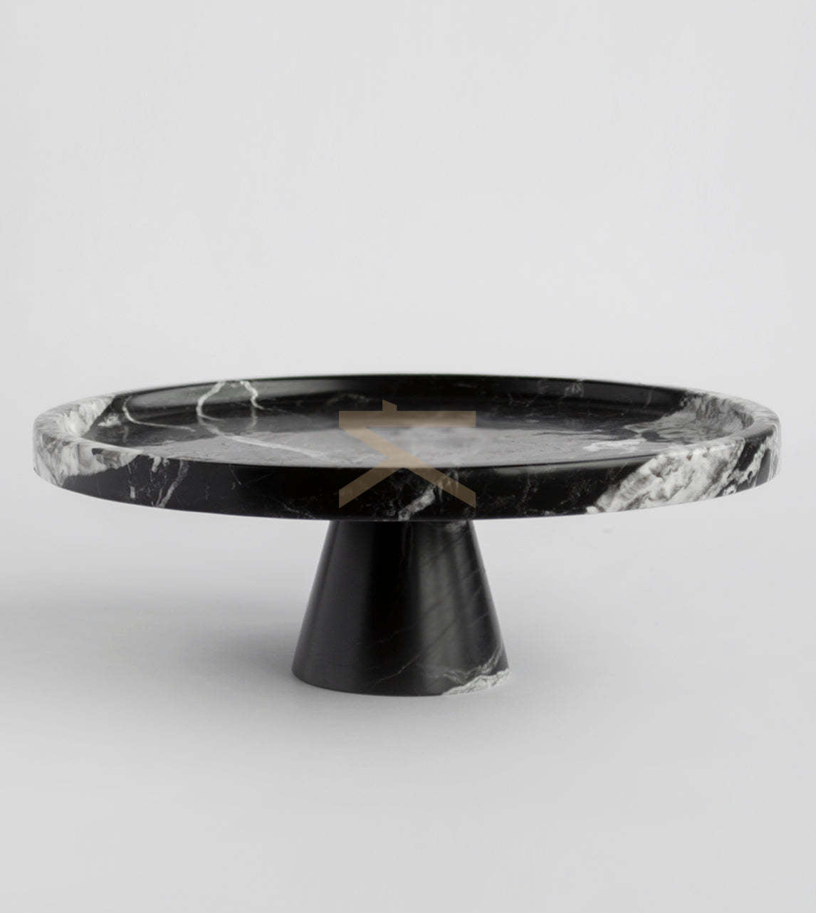Black marble cake stand on display