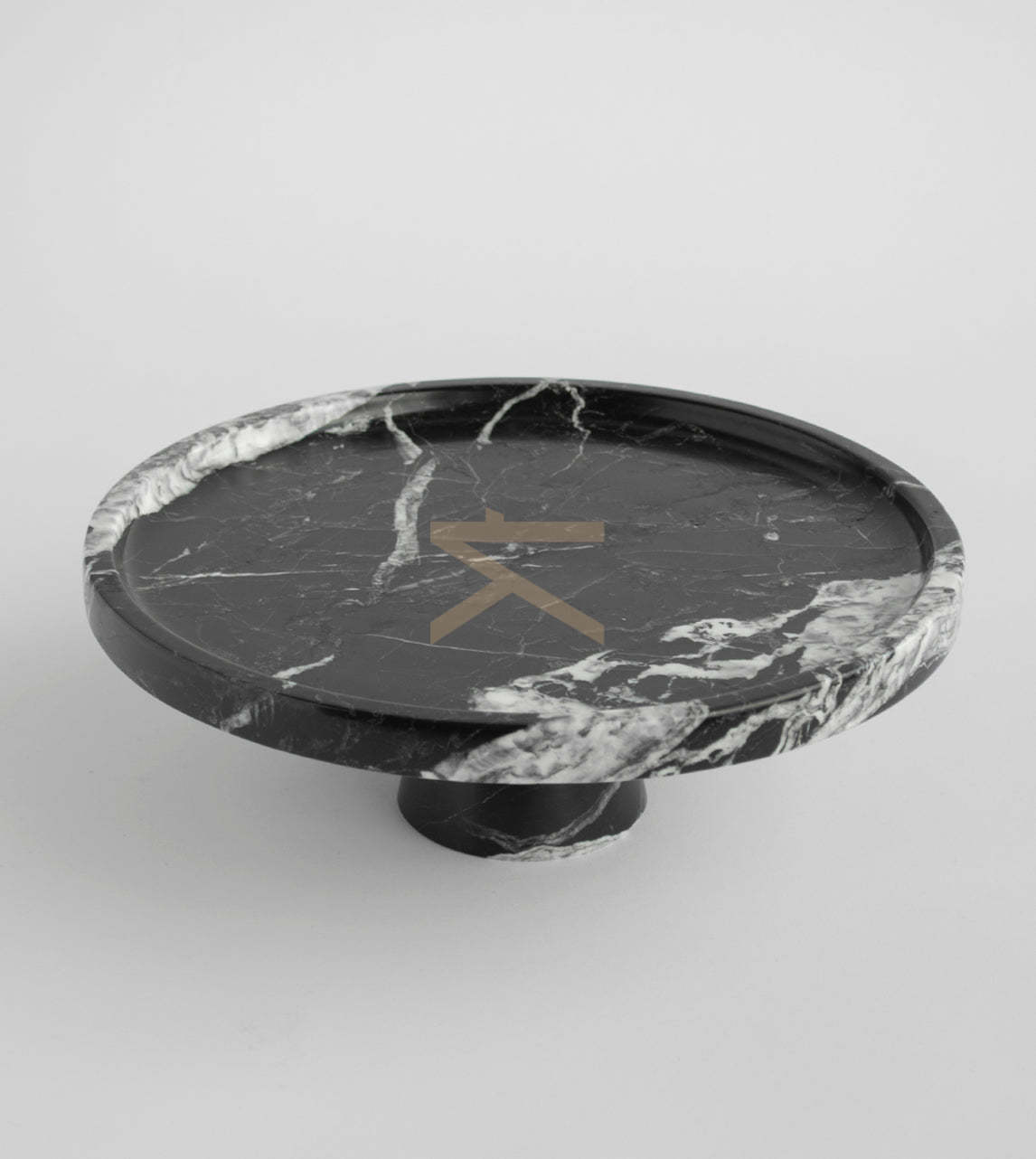 Black marble cake stand on display