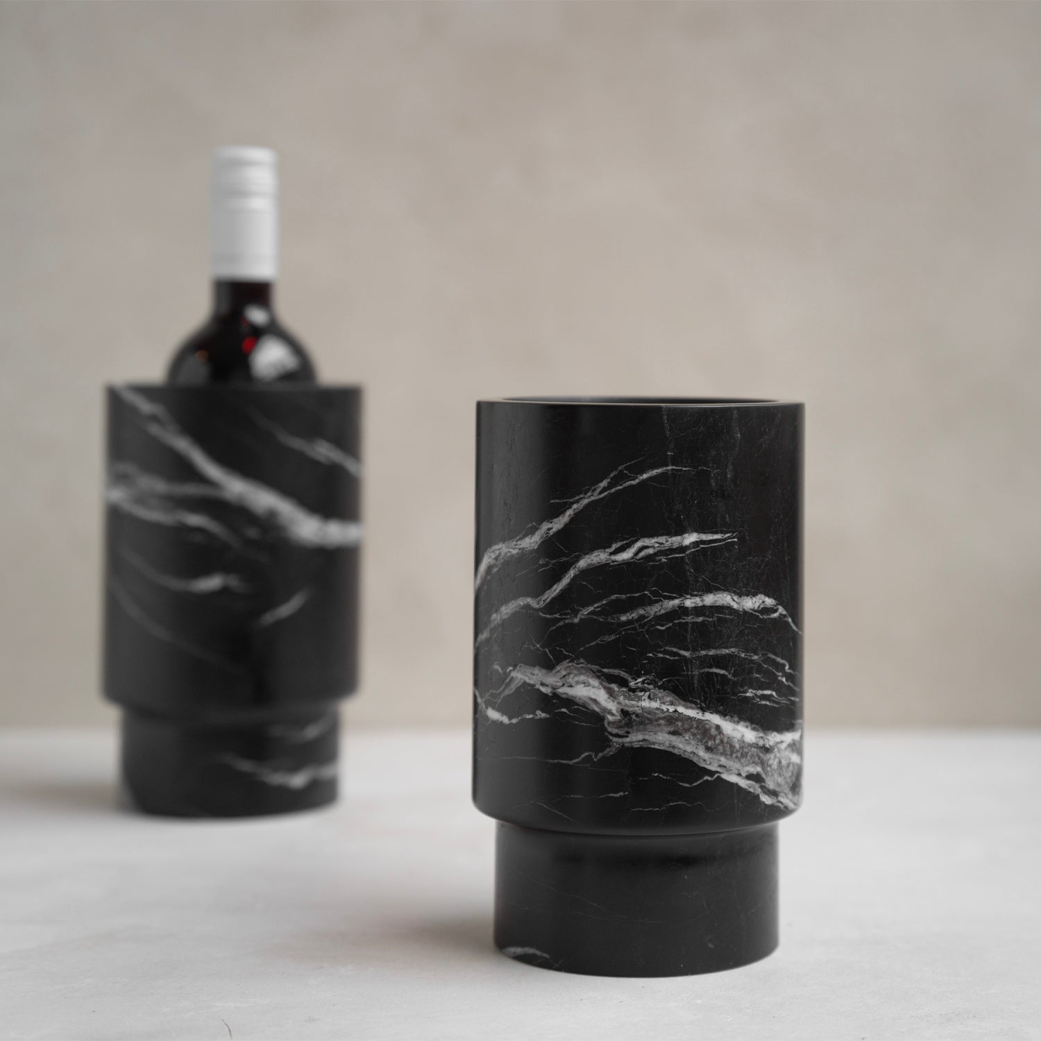 Black marble wine cooler with white veining