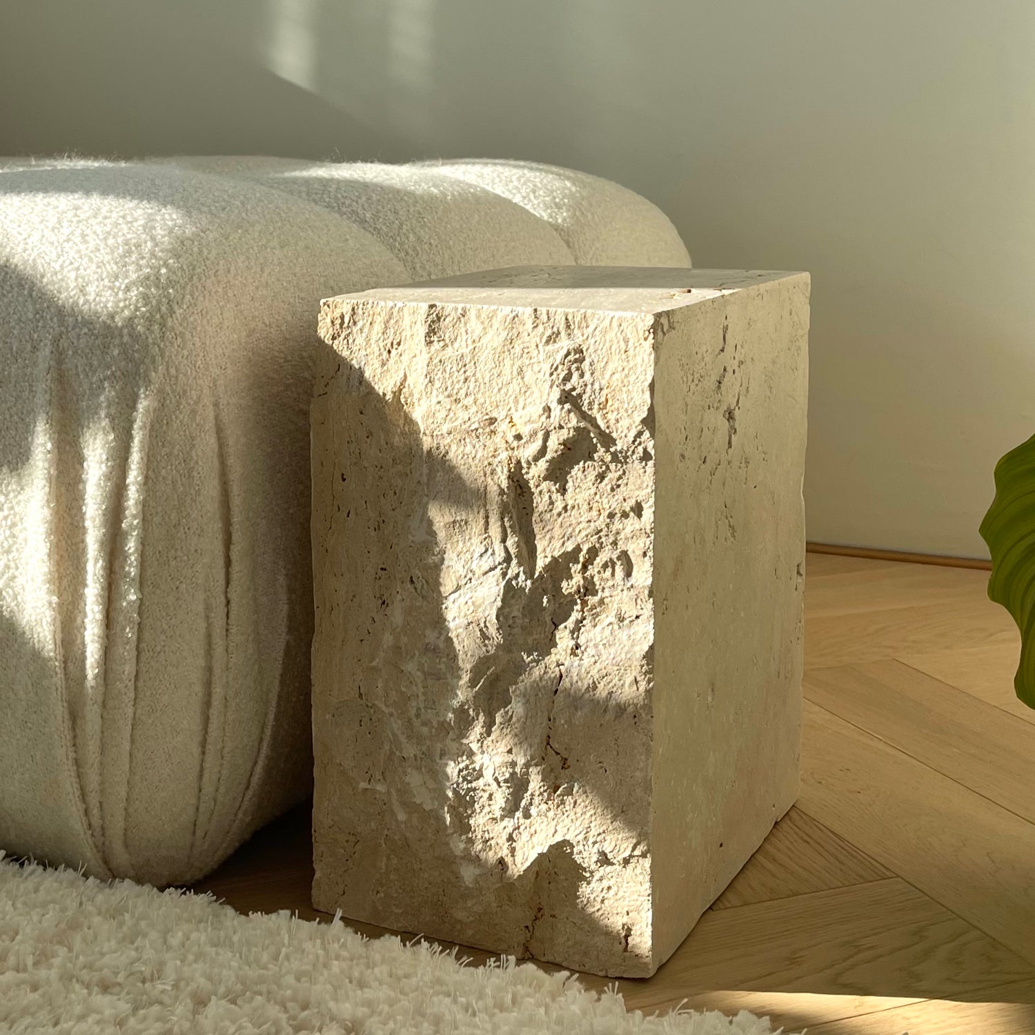 Travertine side table with natural stone texture