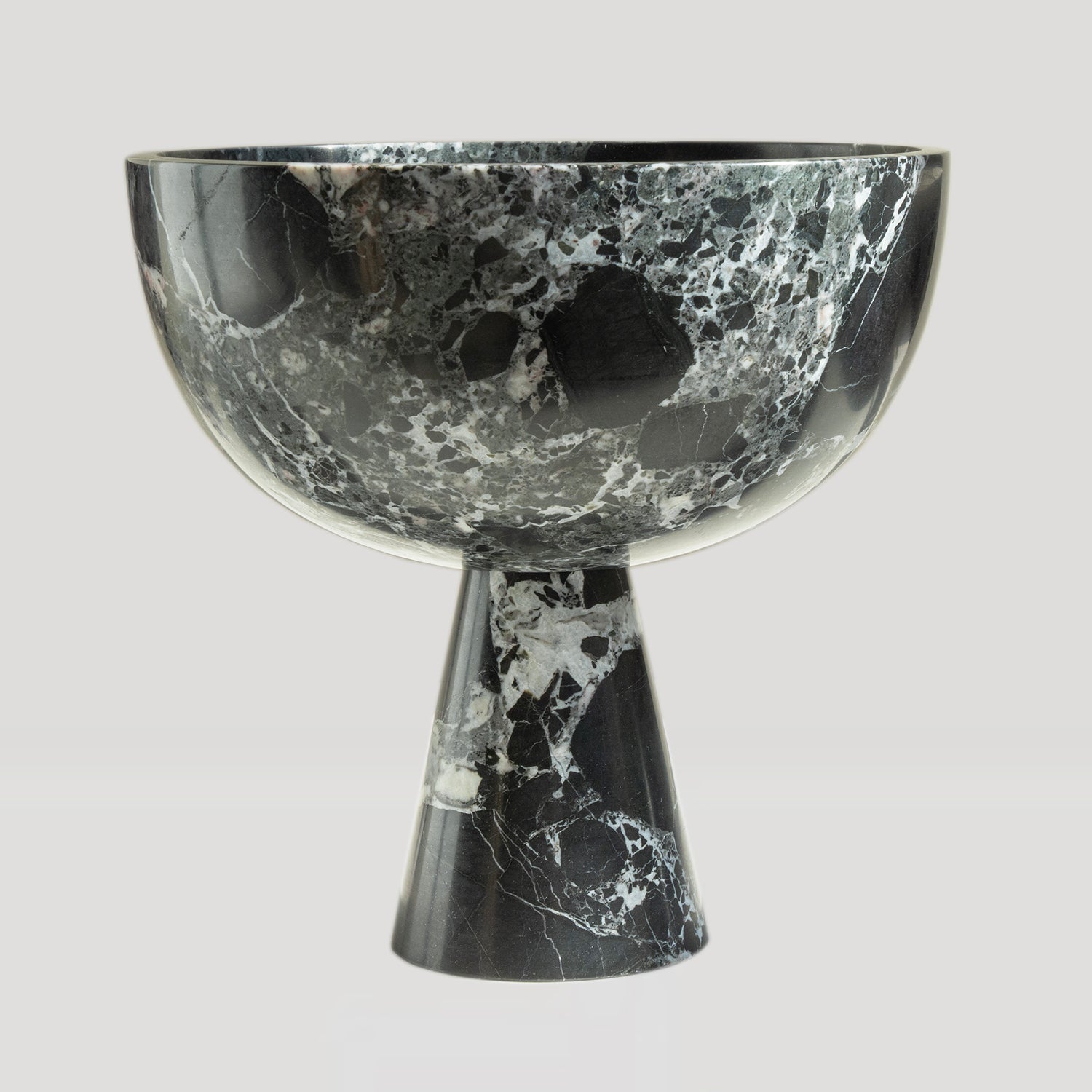 Black marble pedestal bowl with green marble veins