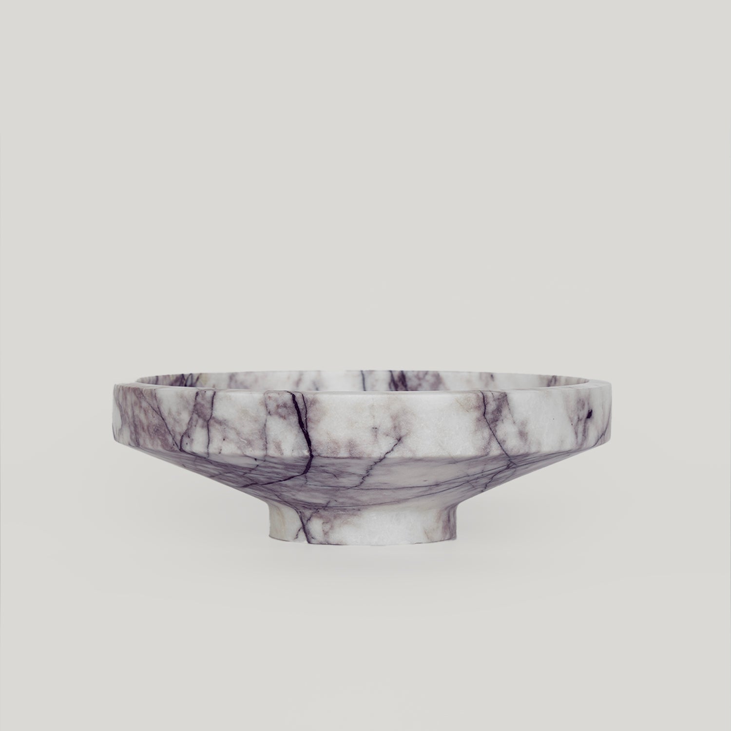 White lilac marble bowl with soft veining on display