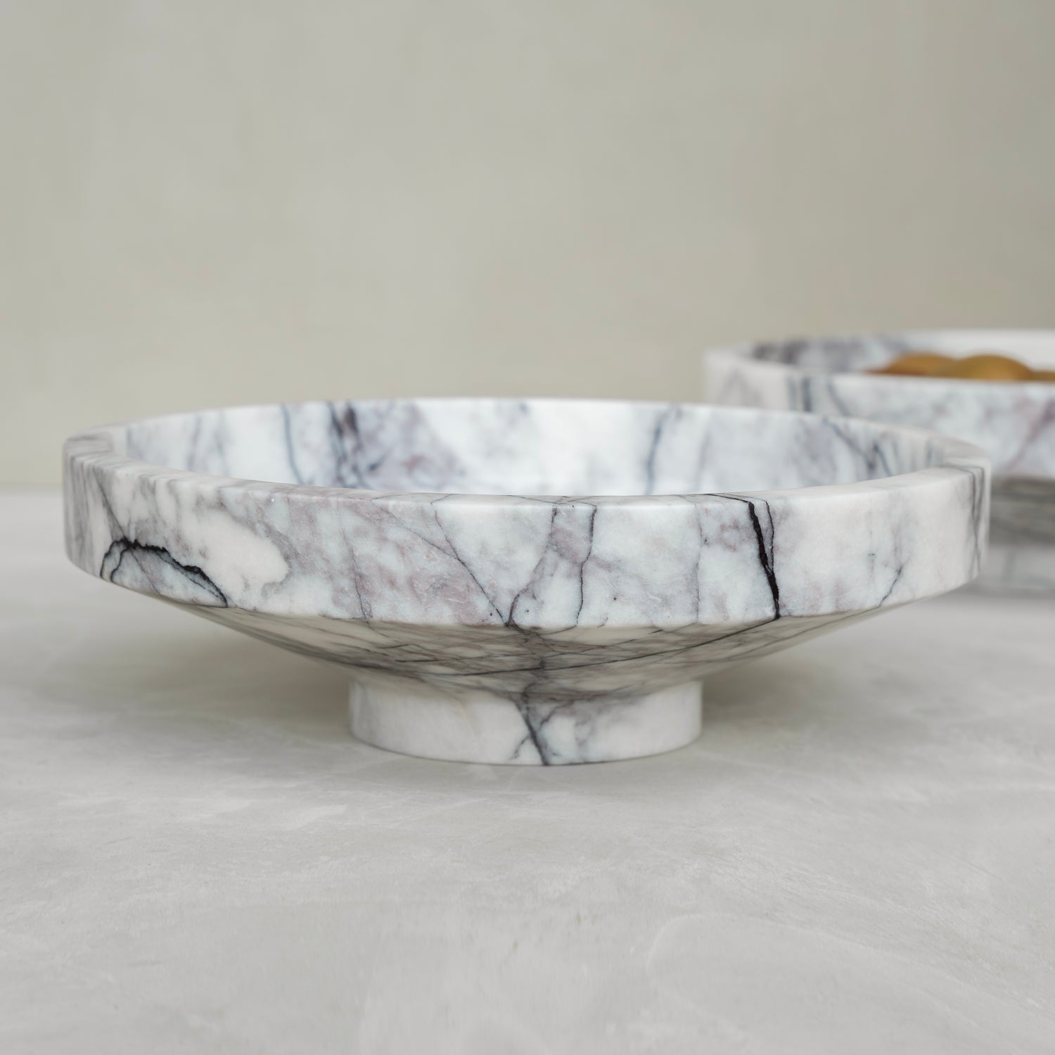 White lilac marble bowl with soft veining on display