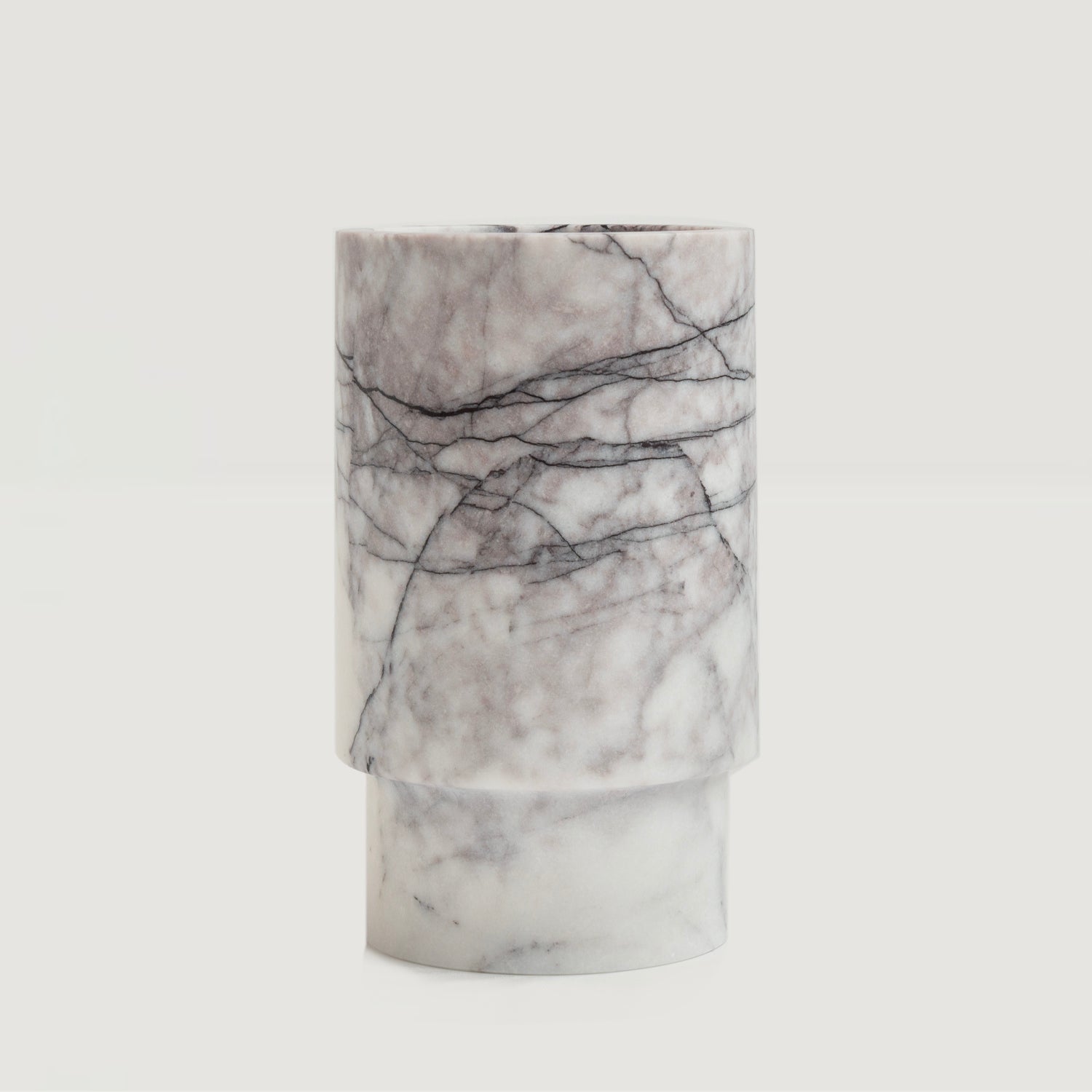 White marble vase used as wine bottle holder