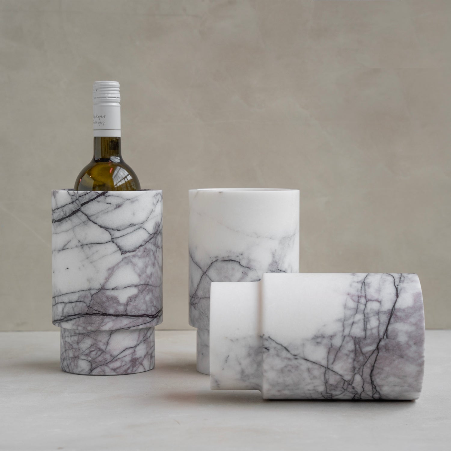 White marble vase used as wine bottle holder