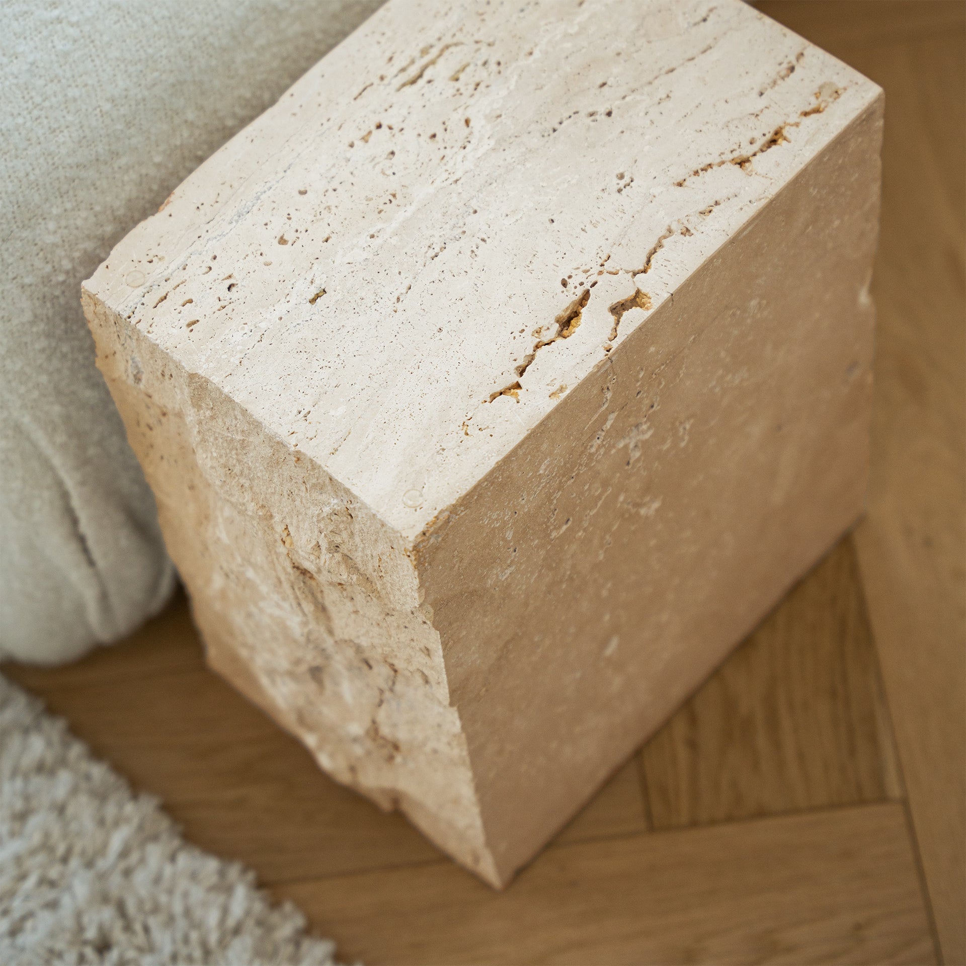 Travertine side table with natural stone texture