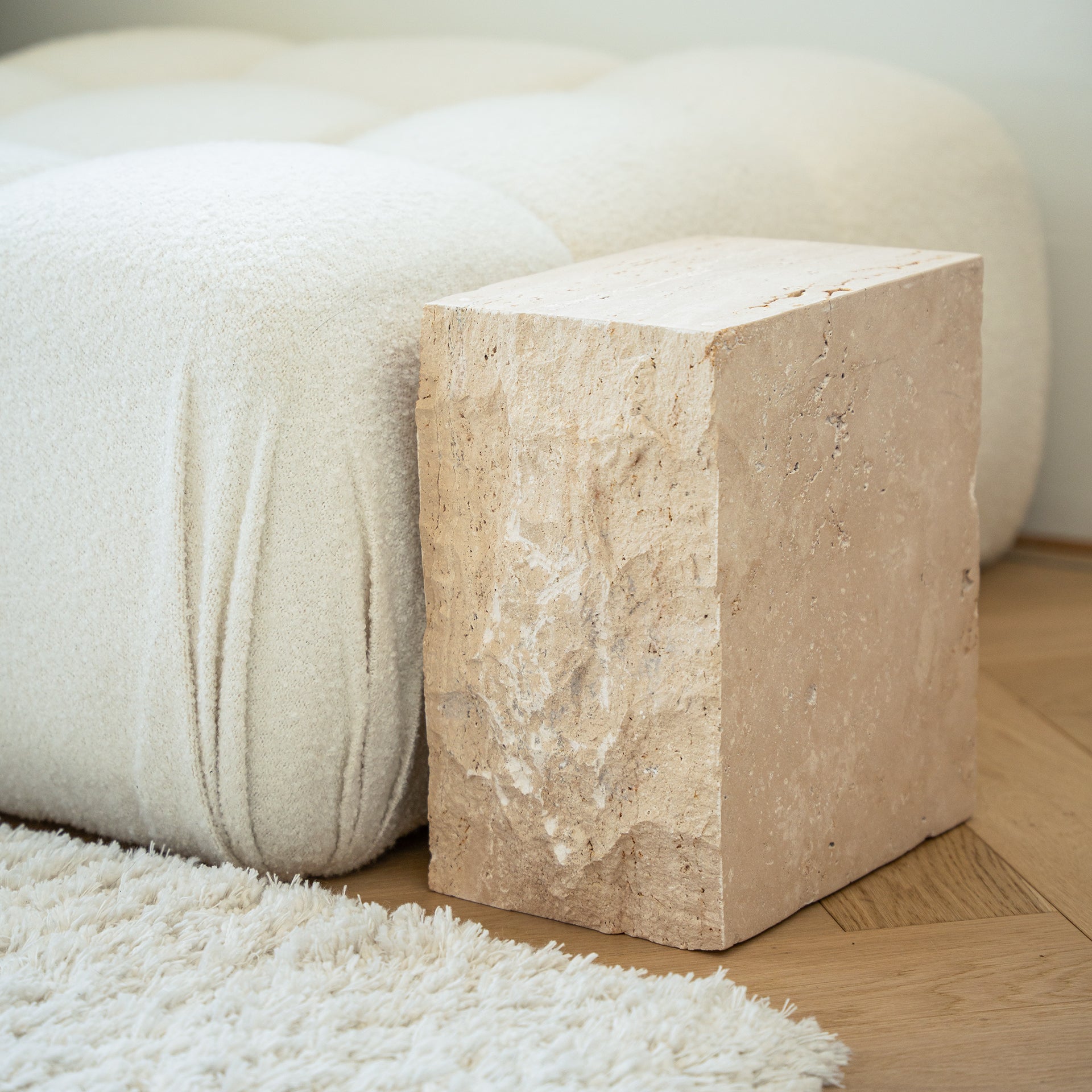 Travertine side table with natural stone texture