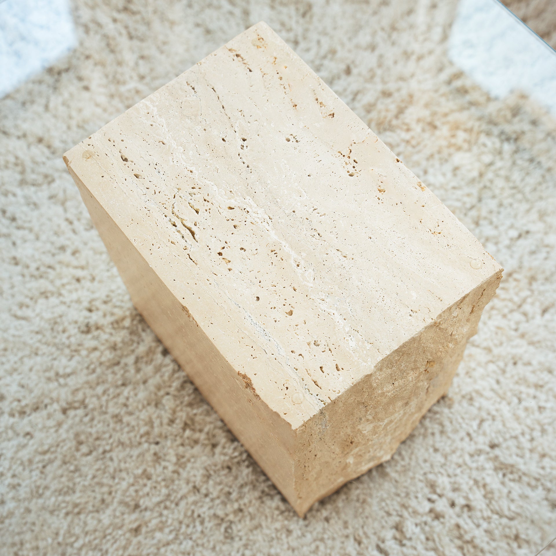 Travertine side table with natural stone texture