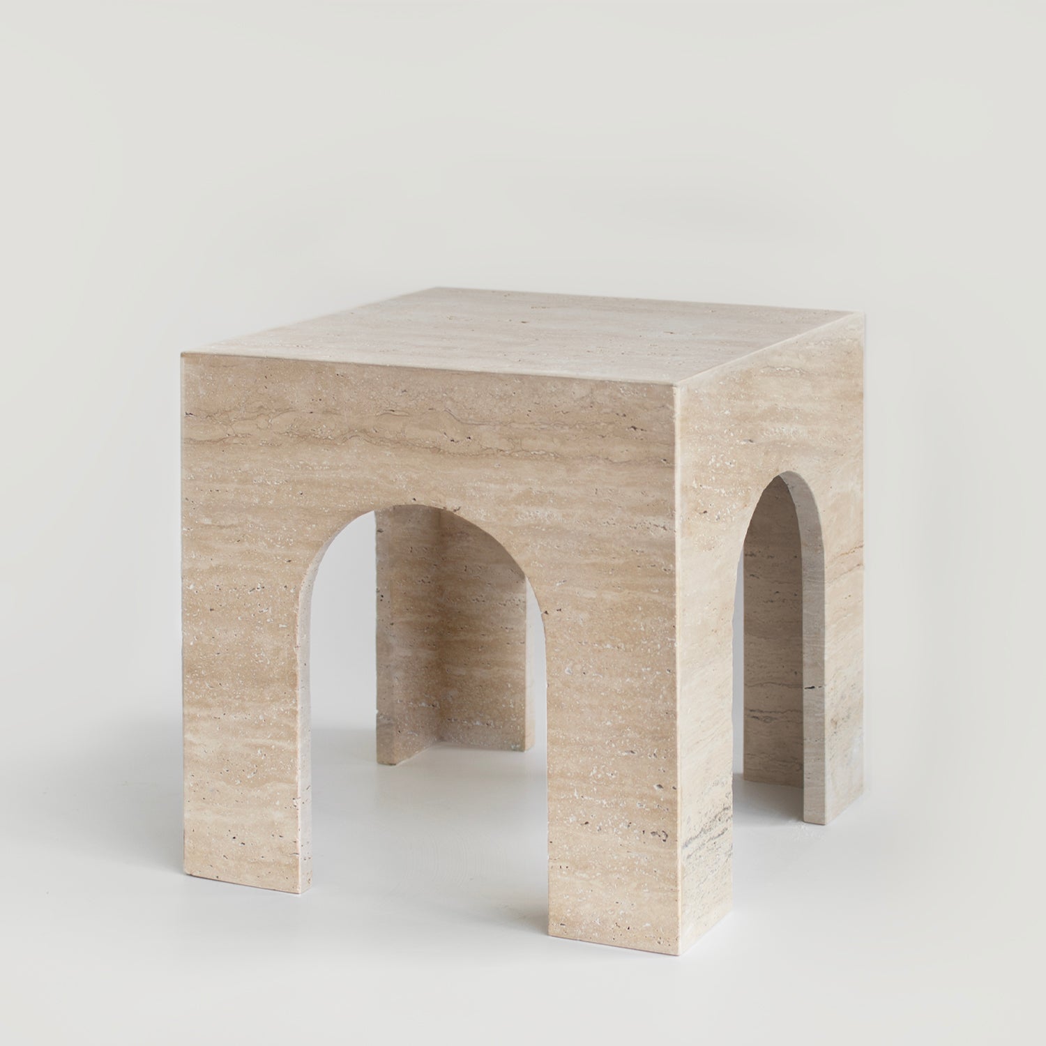 Travertine arch side table with marble top and curved base