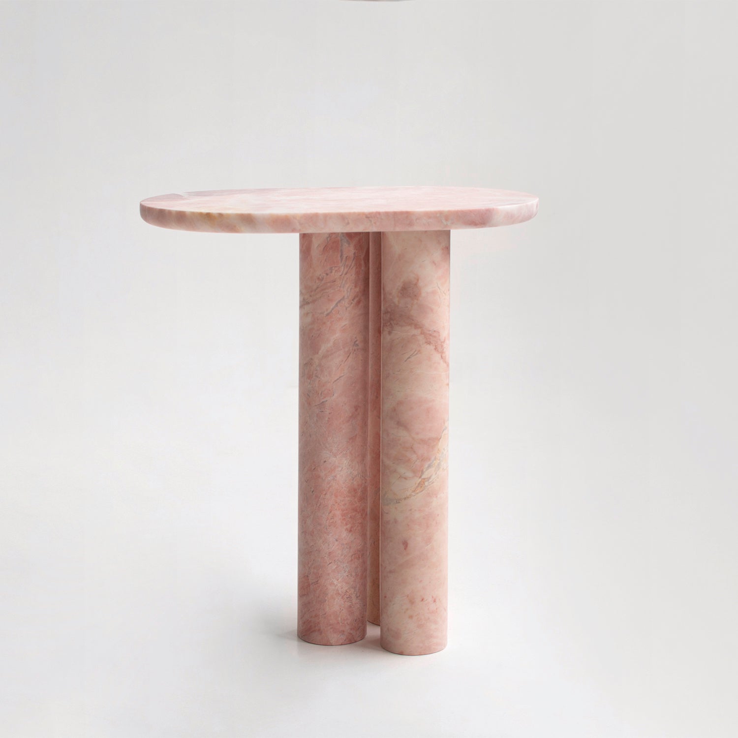 Pink marble side table with three round column legs