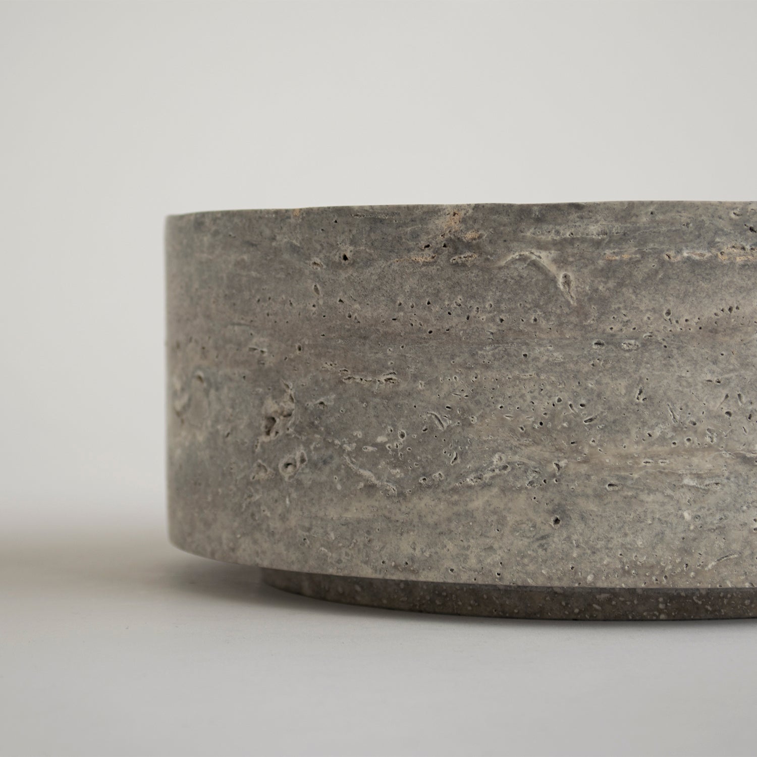Silver travertine bowl with smooth matte finish and round shape