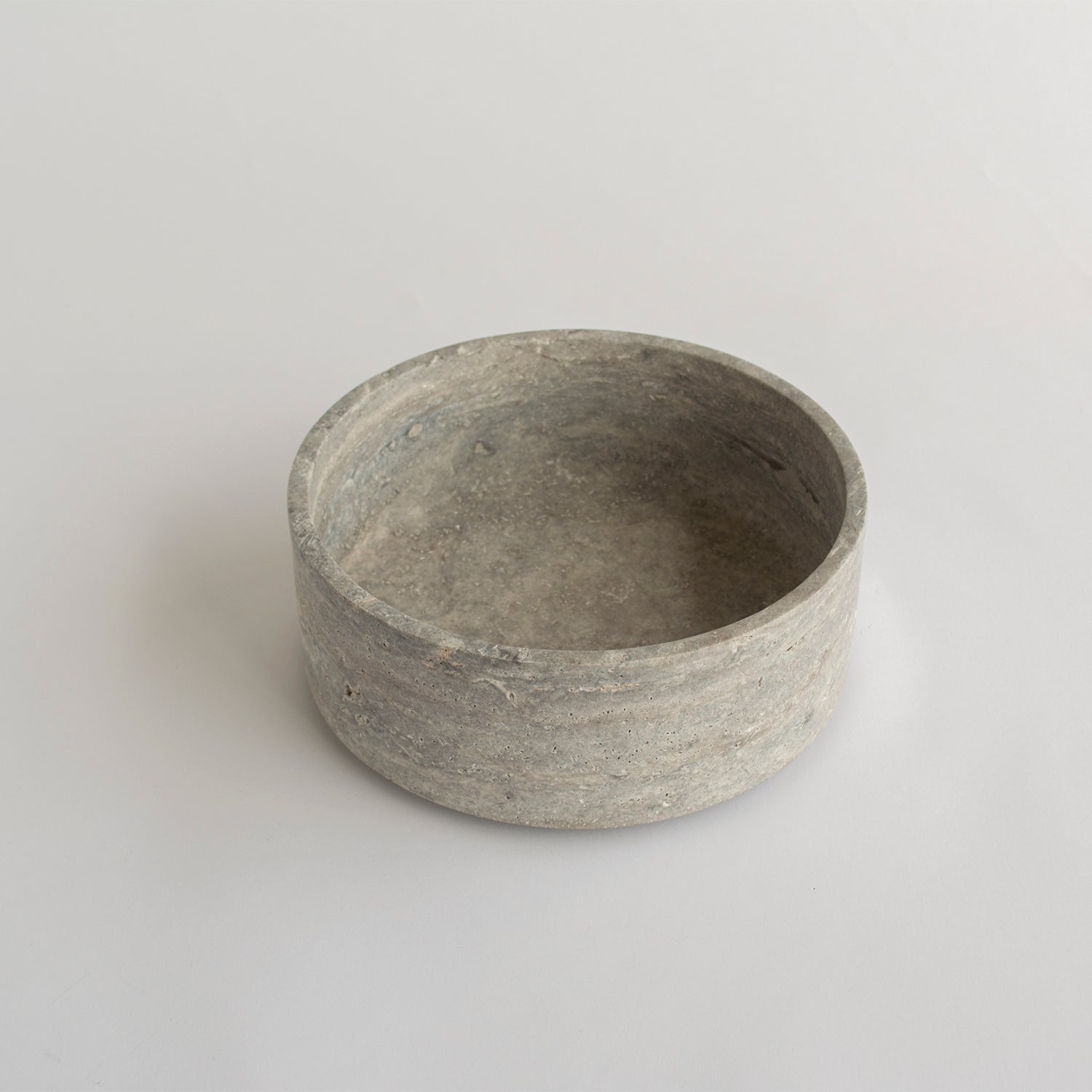Silver travertine bowl with smooth matte finish and round shape