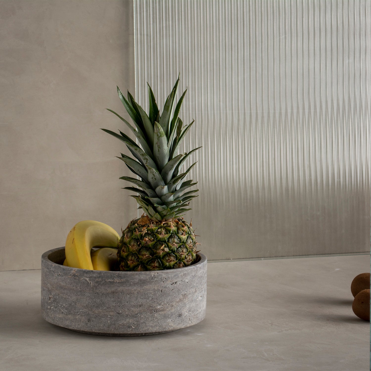 Silver travertine bowl with smooth matte finish and round shape