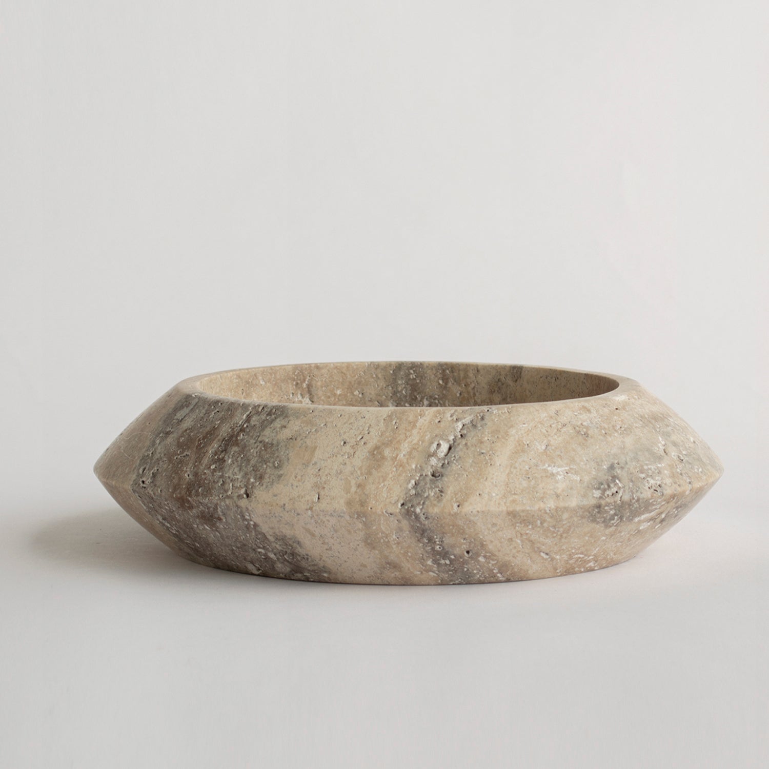 Silver travertine bowl with round sculptural shape