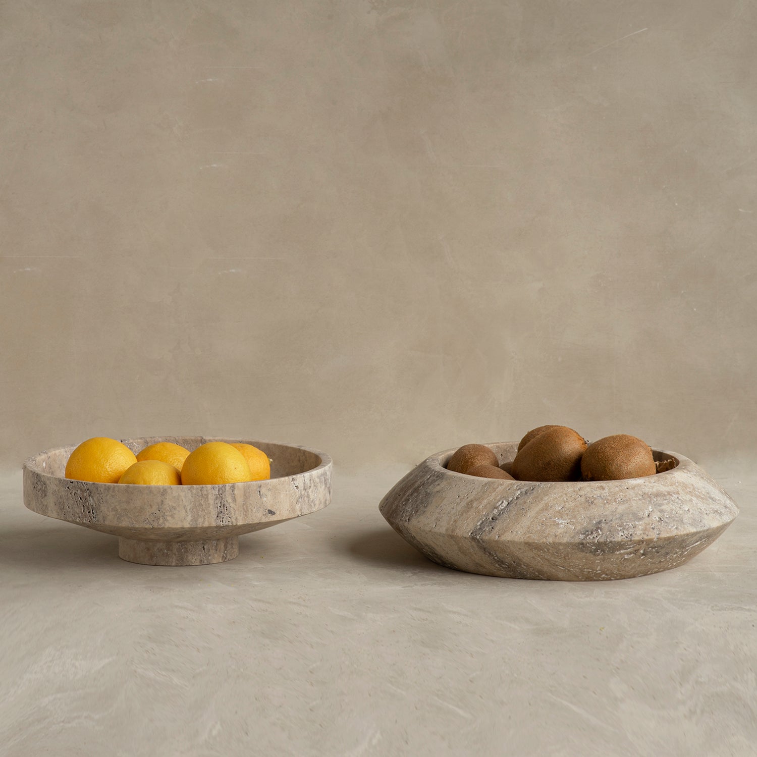 Silver travertine bowl with round sculptural shape