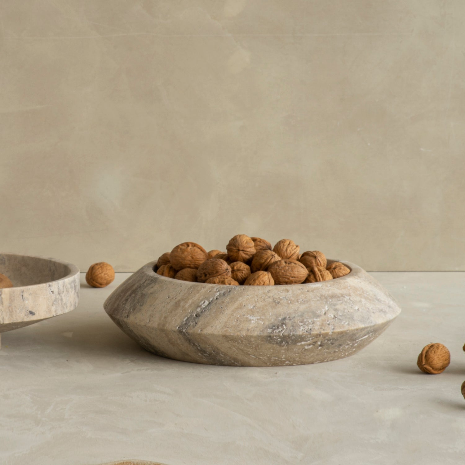 Silver travertine bowl with round sculptural shape
