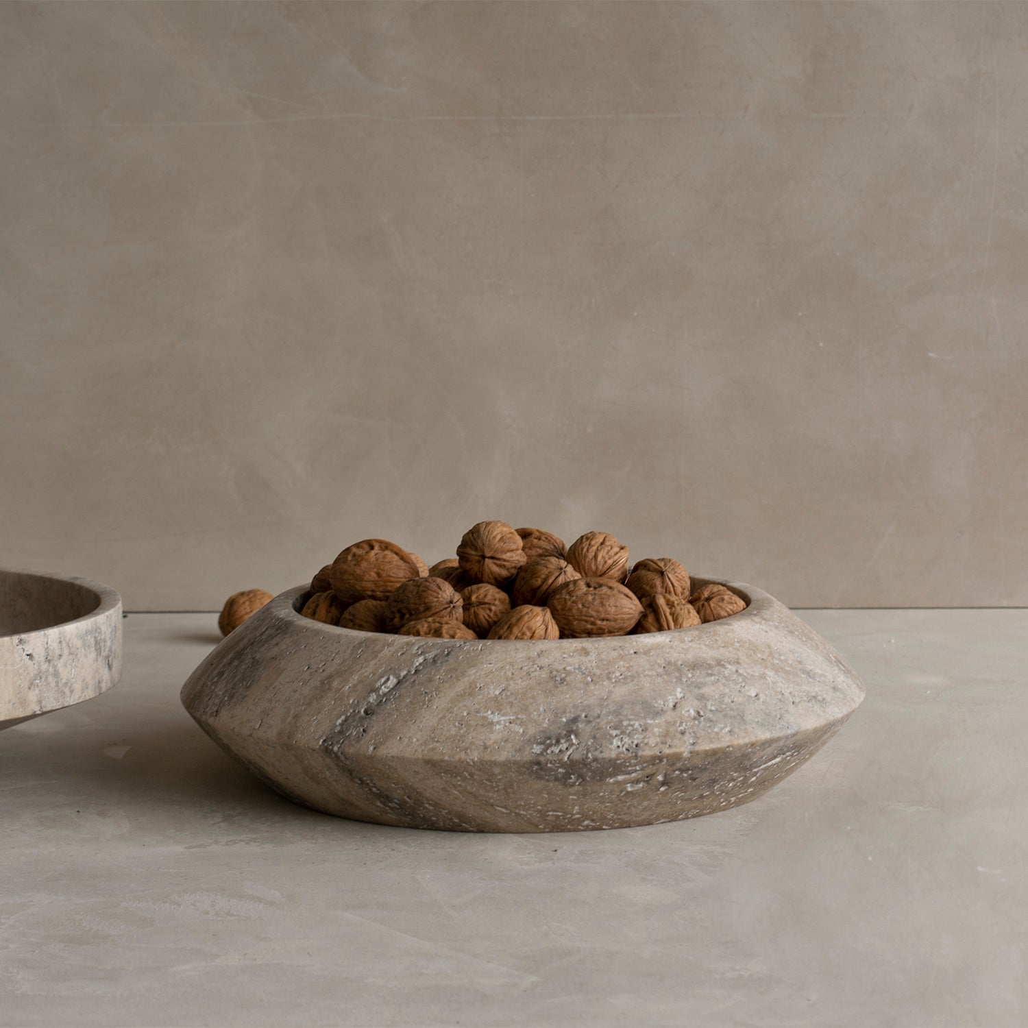 Silver travertine bowl with round sculptural shape