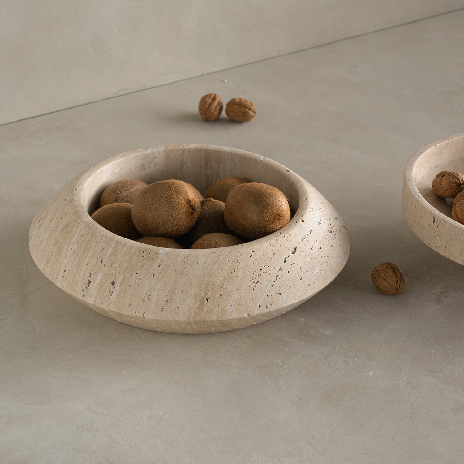 Decorative travertine bowl with natural stone texture