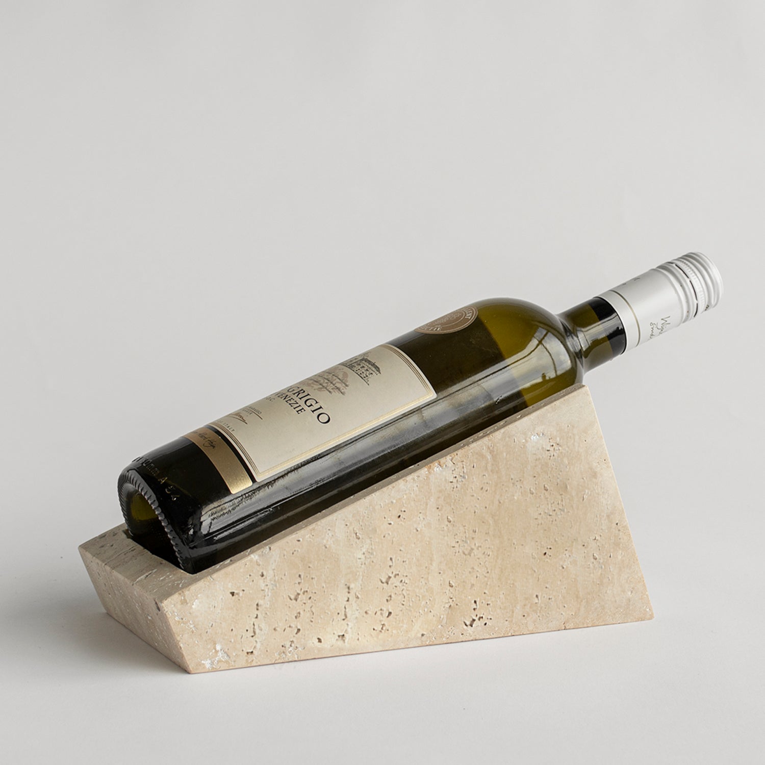 Travertine wine stand with one bottle on display