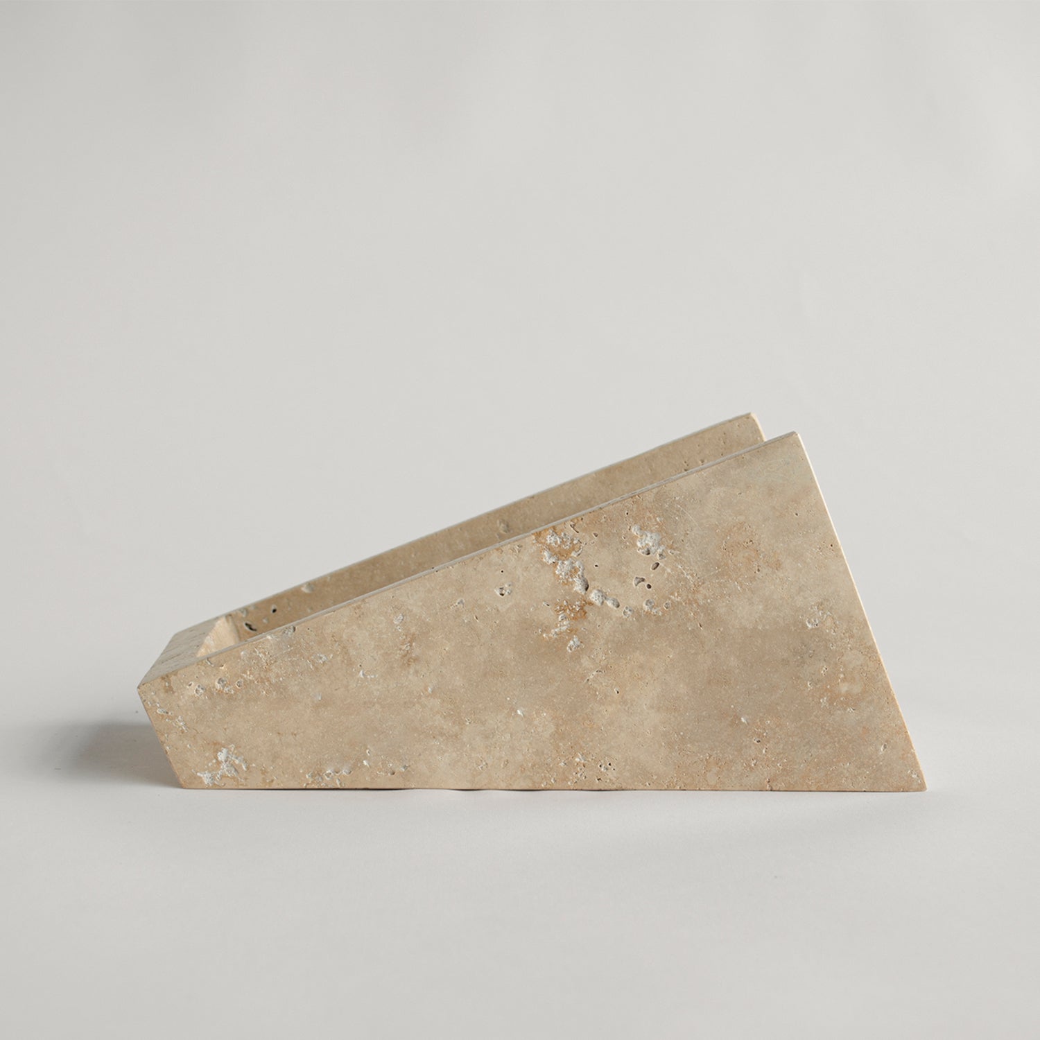 Travertine wine stand with one bottle on display